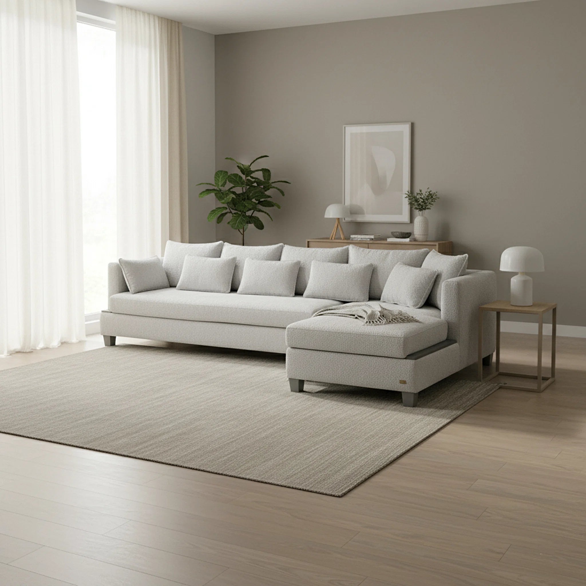 Modern living room with a white sofa, side table, and decor items.
