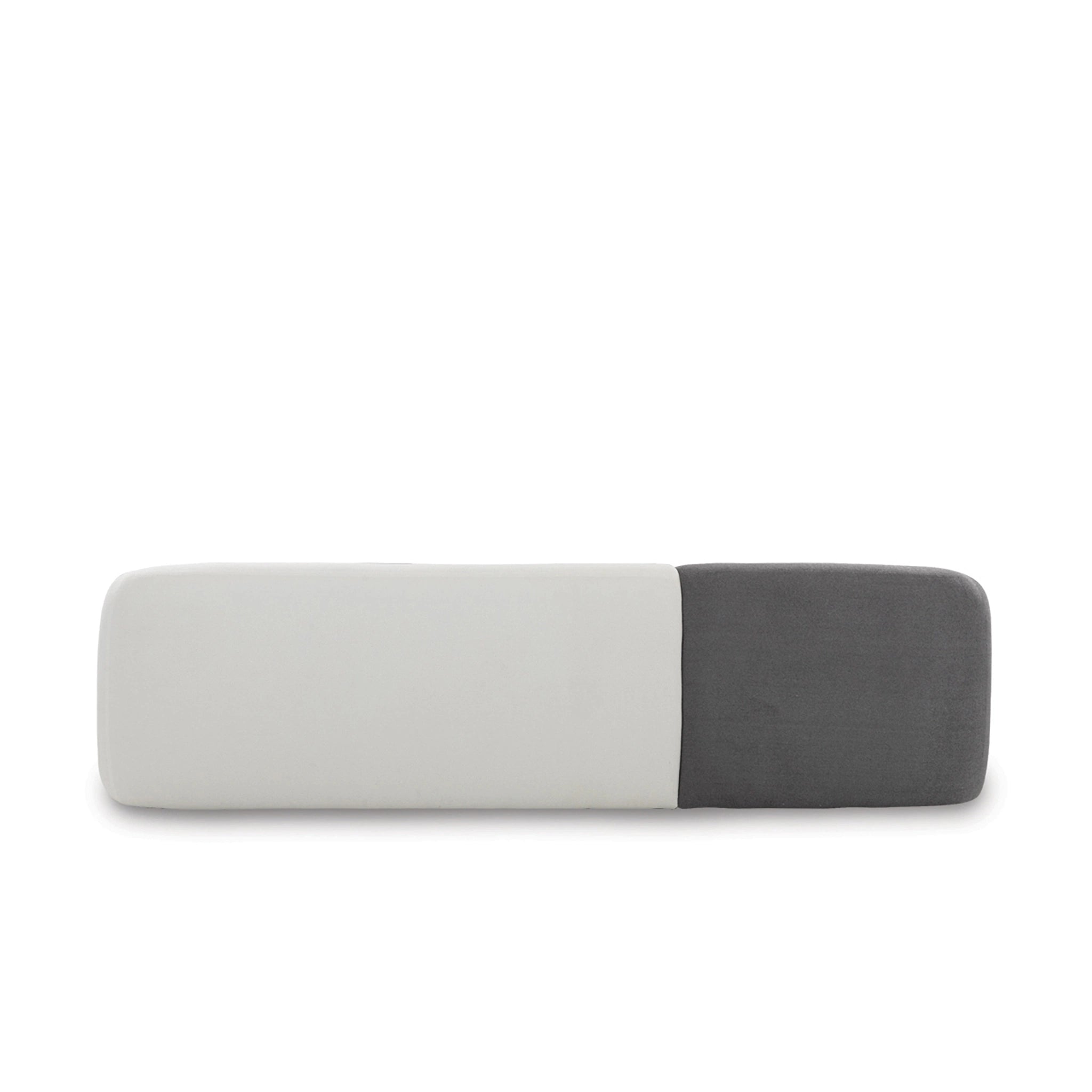 Rectangular cushion with gray and white color block design on a white background