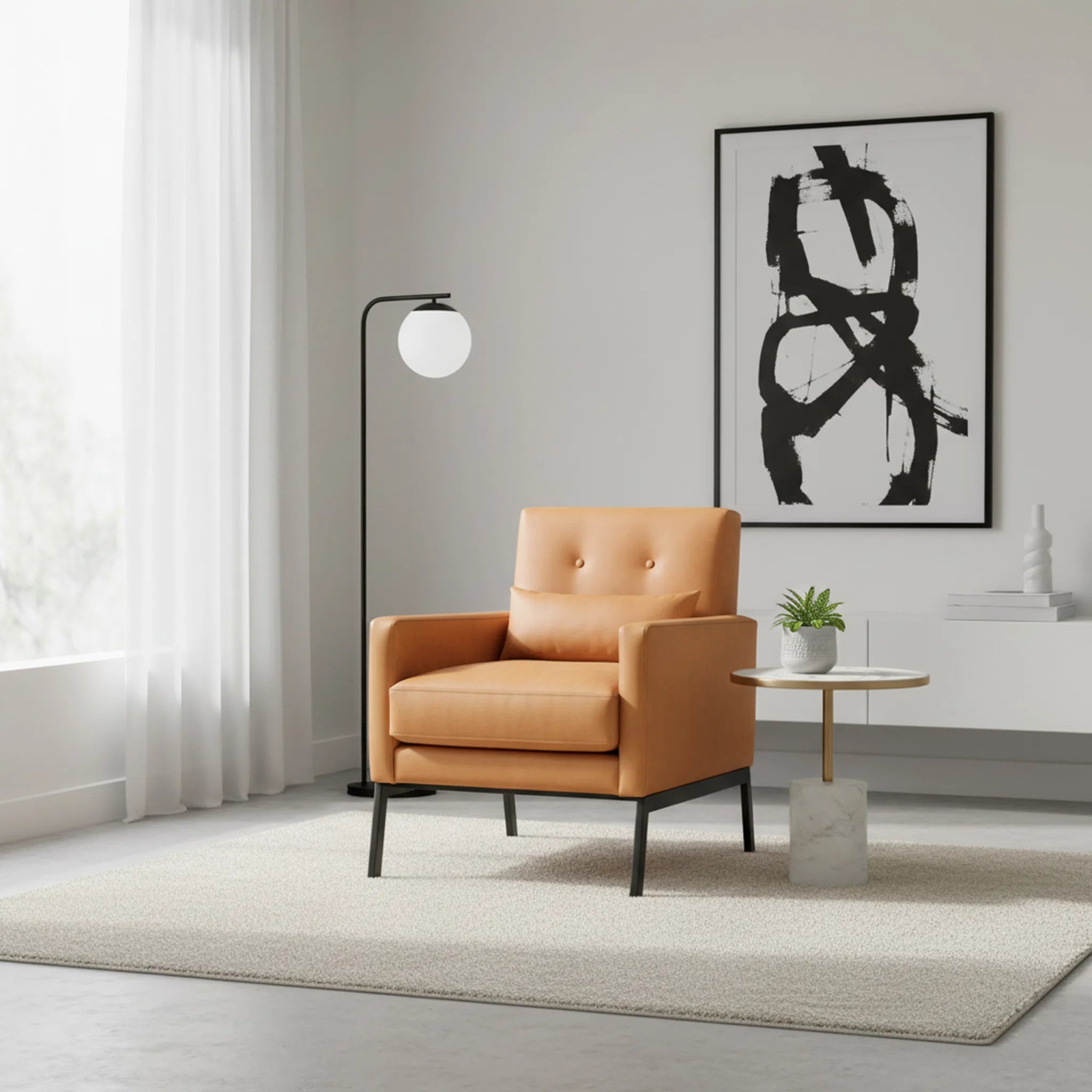 Modern living room with a tan armchair, abstract art, and floor lamp.
