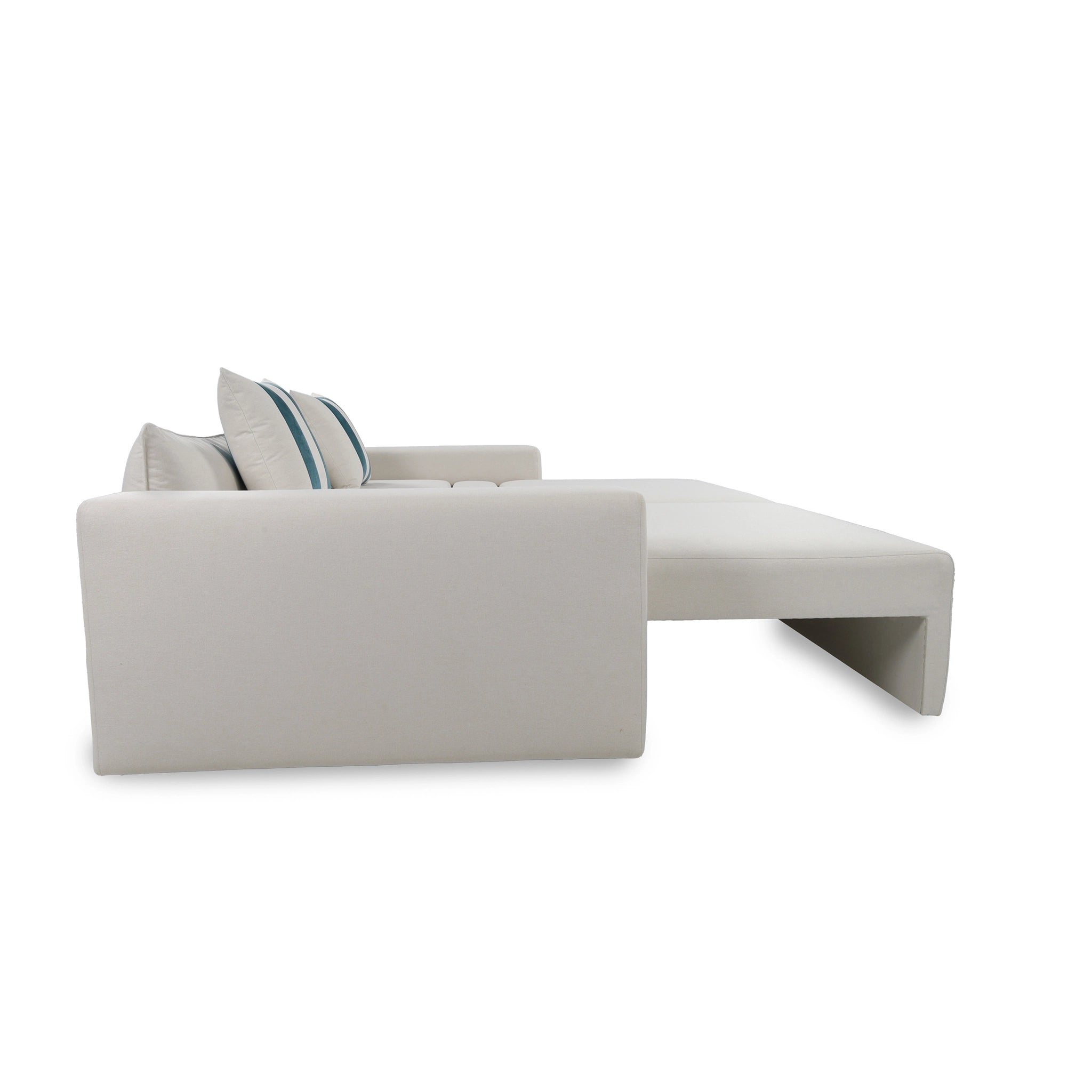 Gray sectional sofa with a striped pillow on a white background