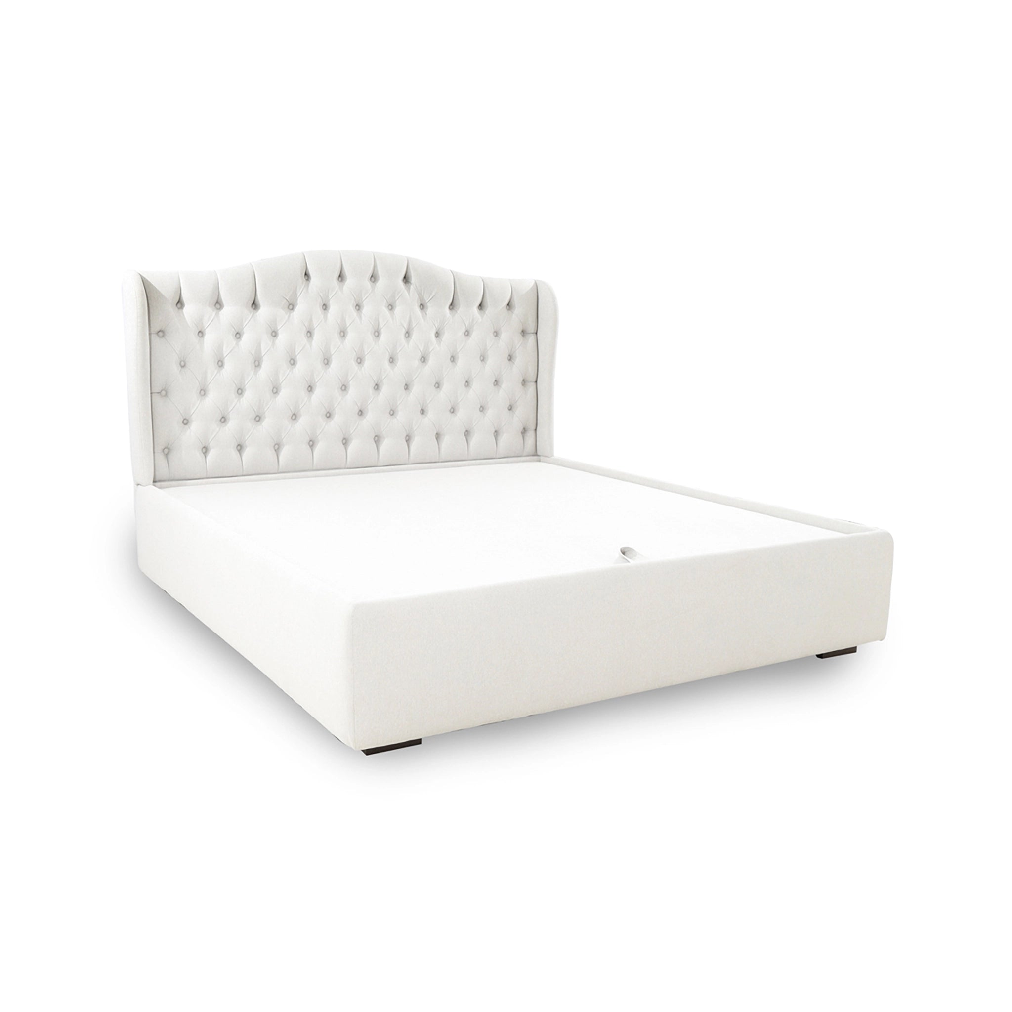 White upholstered bed with tufted headboard on a white background