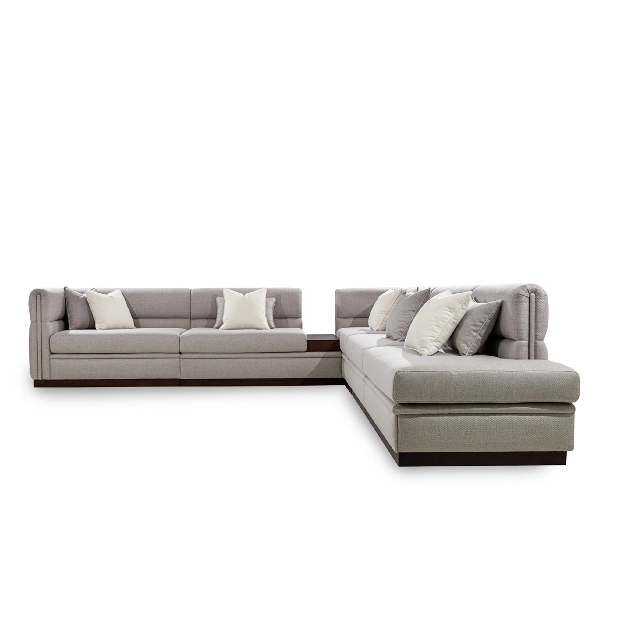 Gray sectional sofa with cushions on a white background