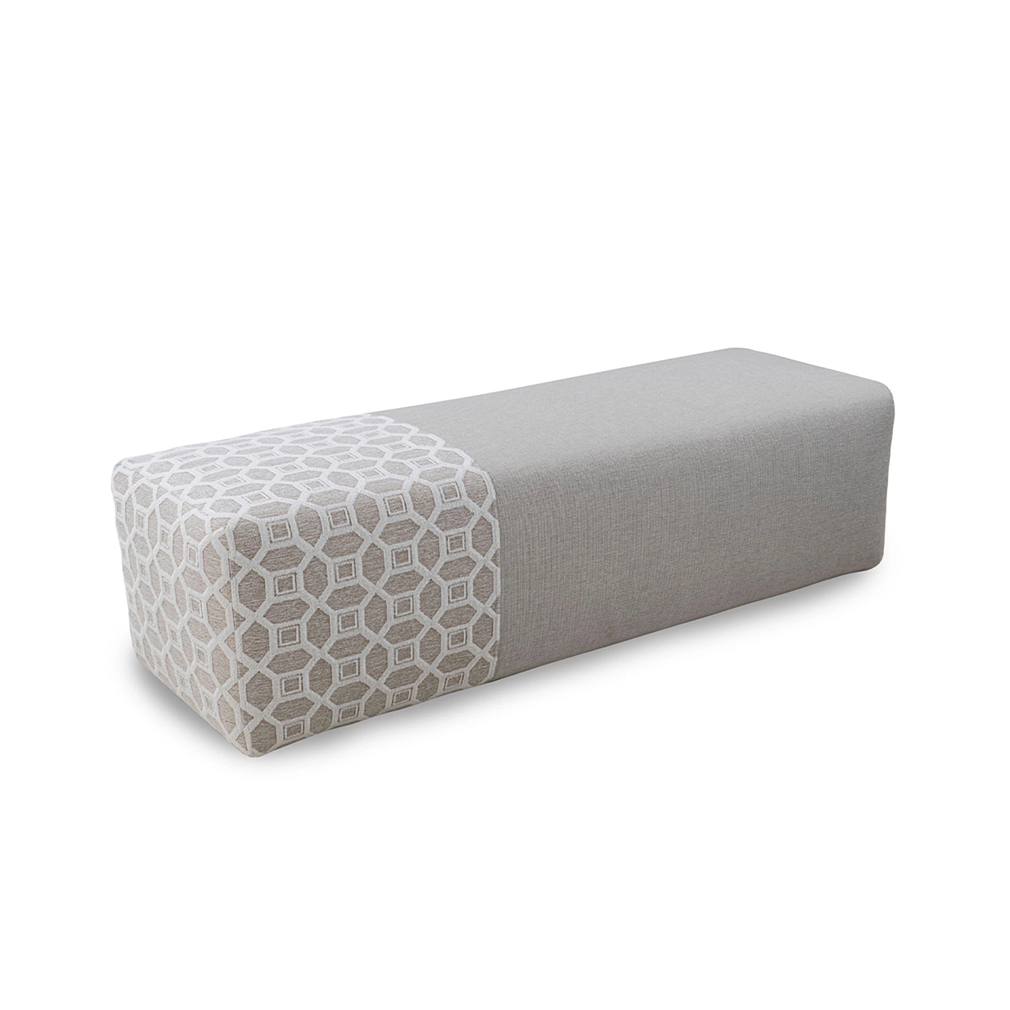 Gray upholstered bench with geometric pattern on a white background