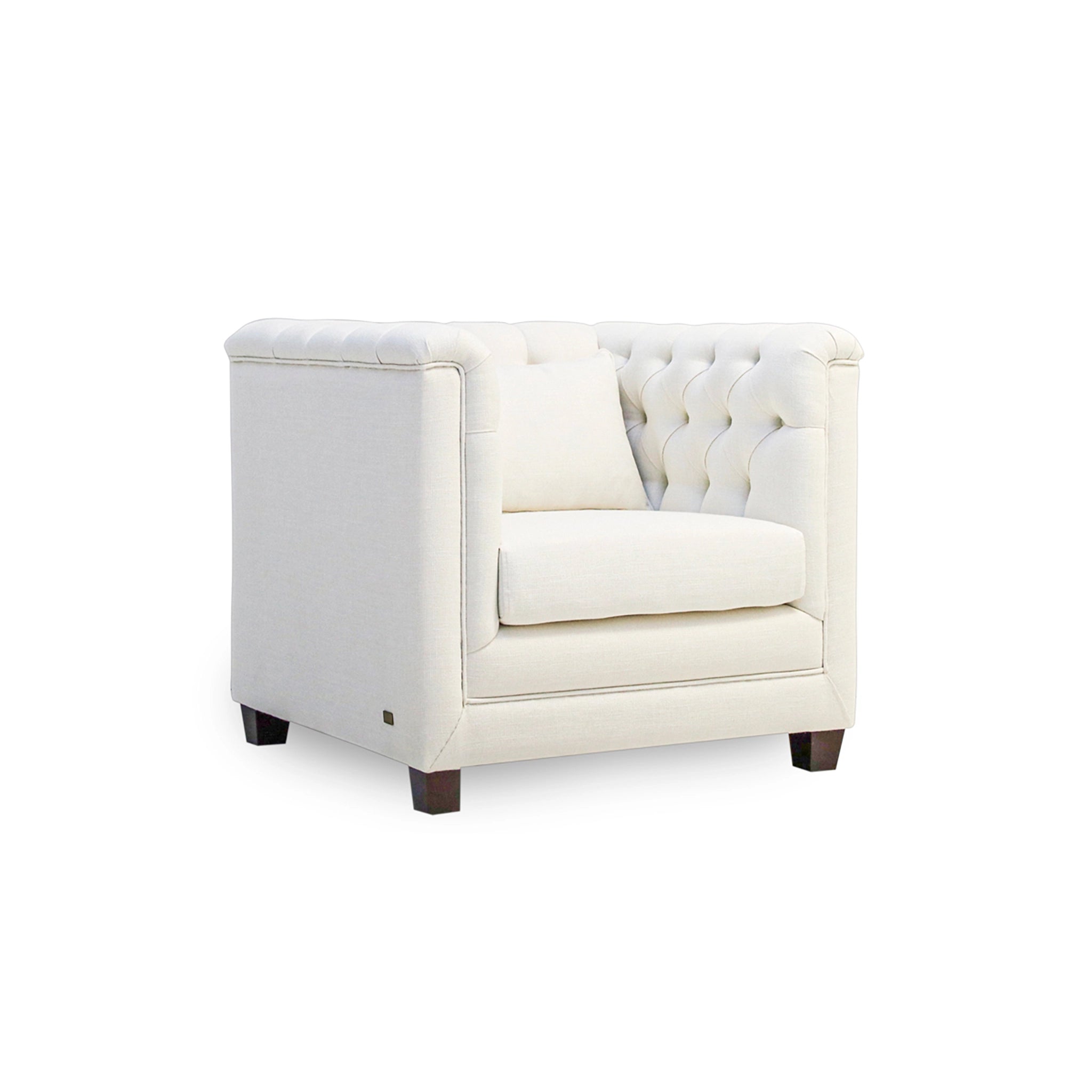 White armchair with tufted backrest on a white background