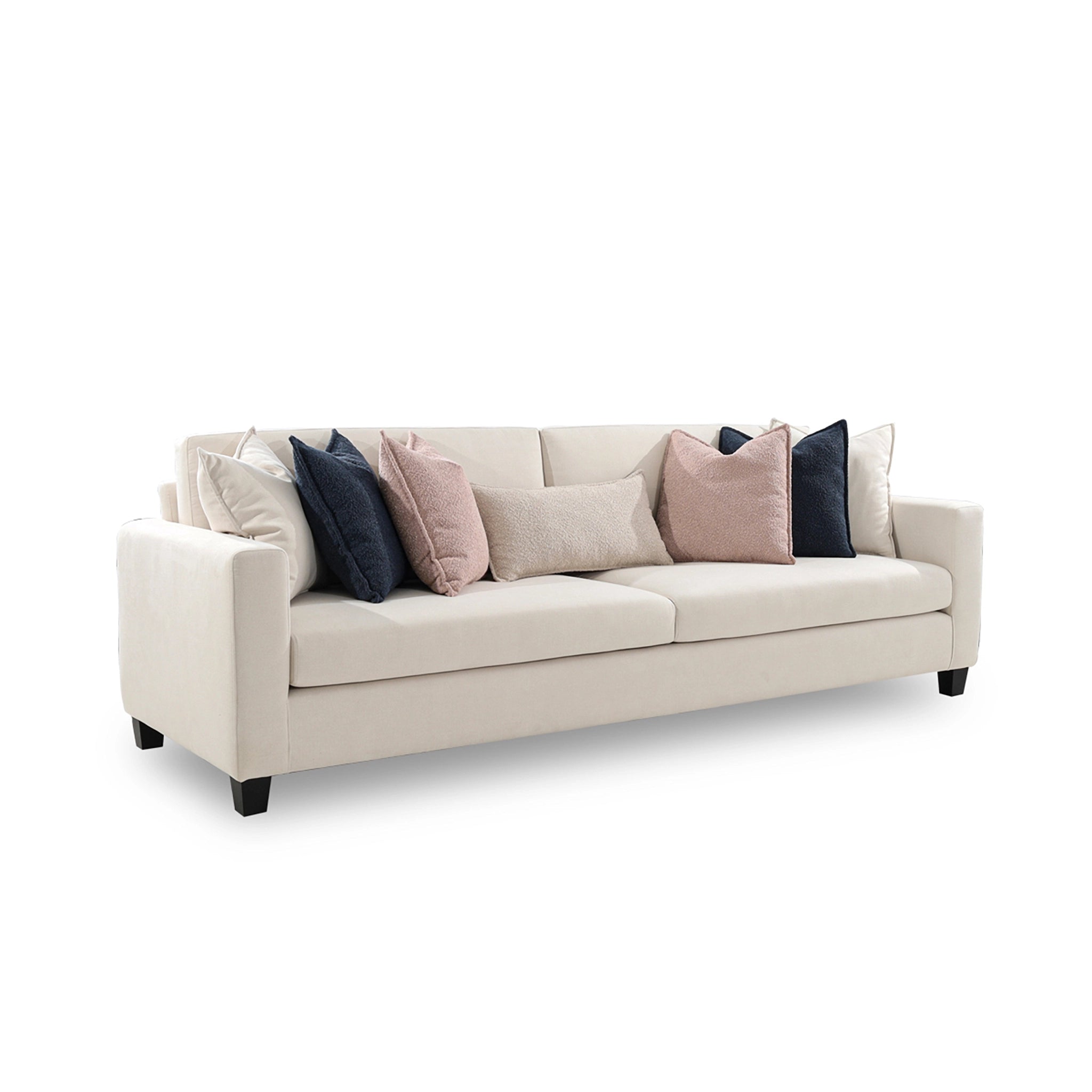Beige sofa with decorative pillows on a white background