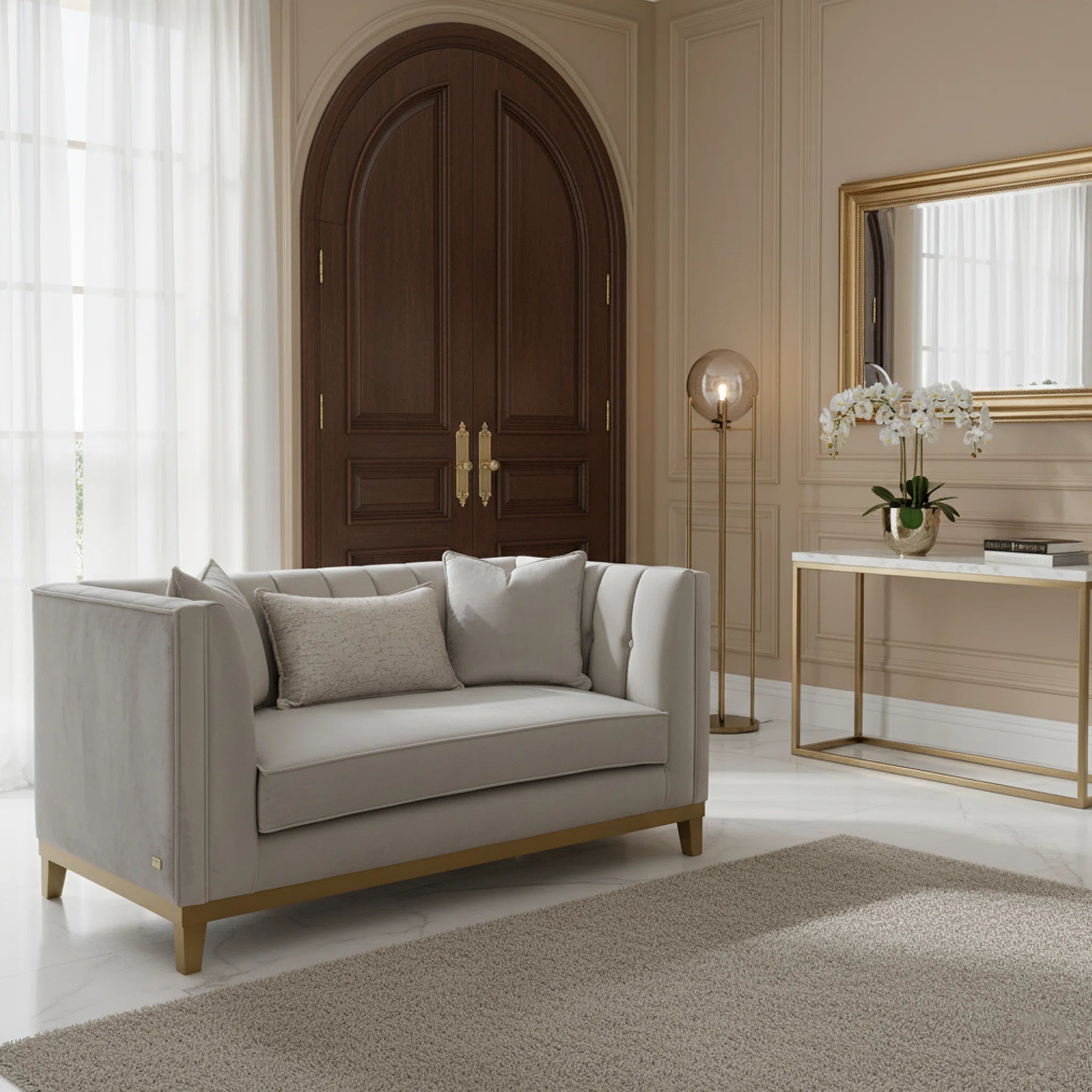 Gray sofa in a stylish living room with a wooden door and decorative elements.