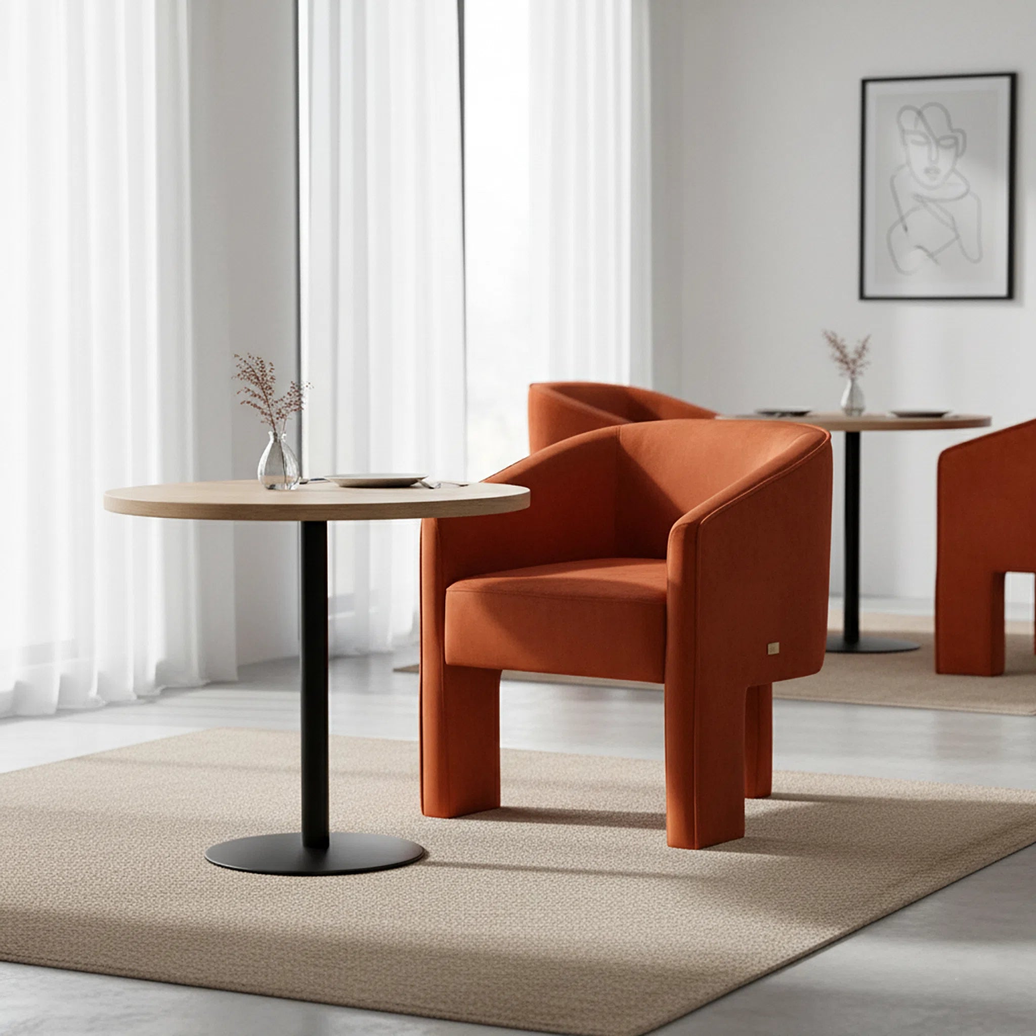 Orange armchair in a modern room with a round table and light decor.