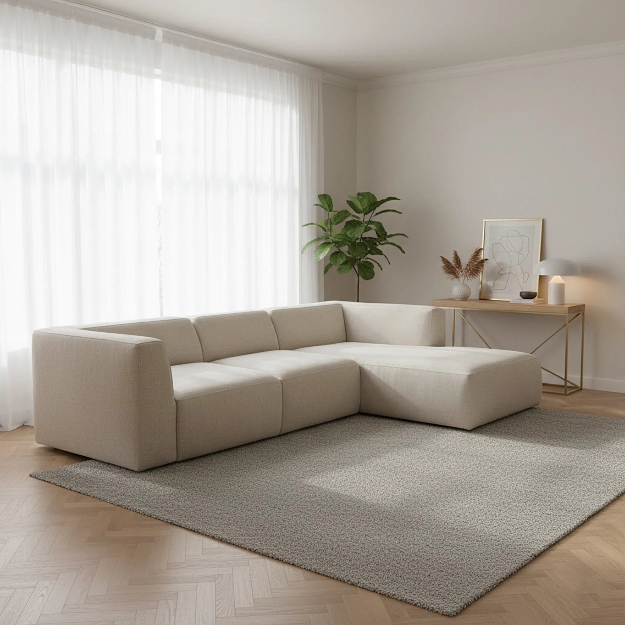Beige sectional sofa in a modern living room with a plant and side table.