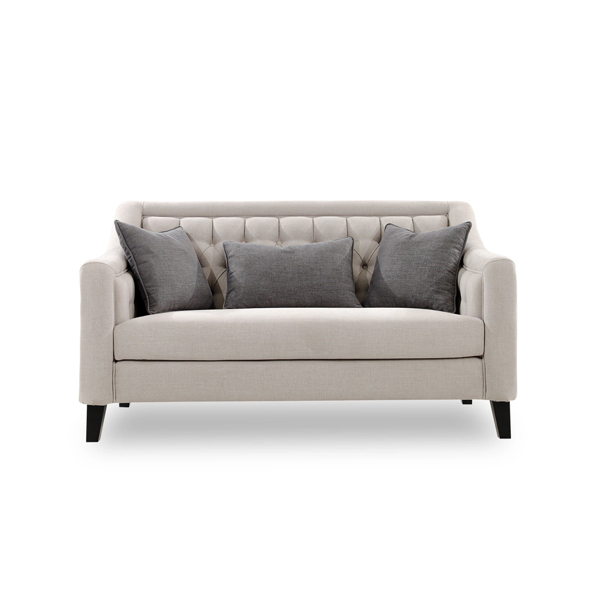 Beige sofa with three gray pillows on a white background