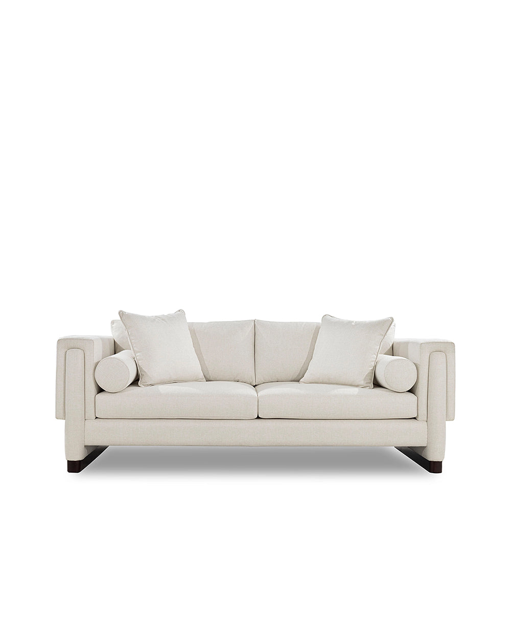 Beige sofa with three cushions on a white background