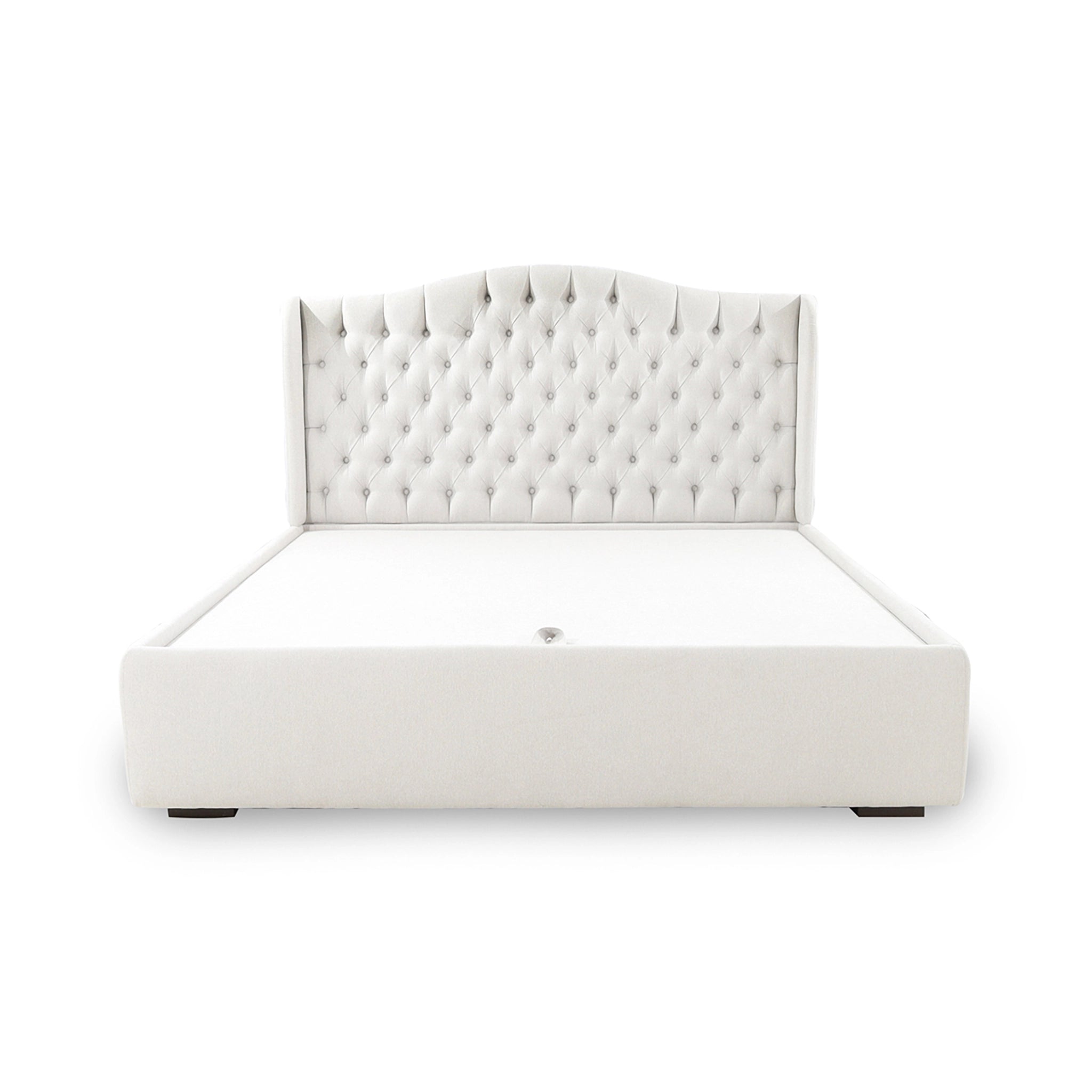 White upholstered bed with tufted headboard on a white background