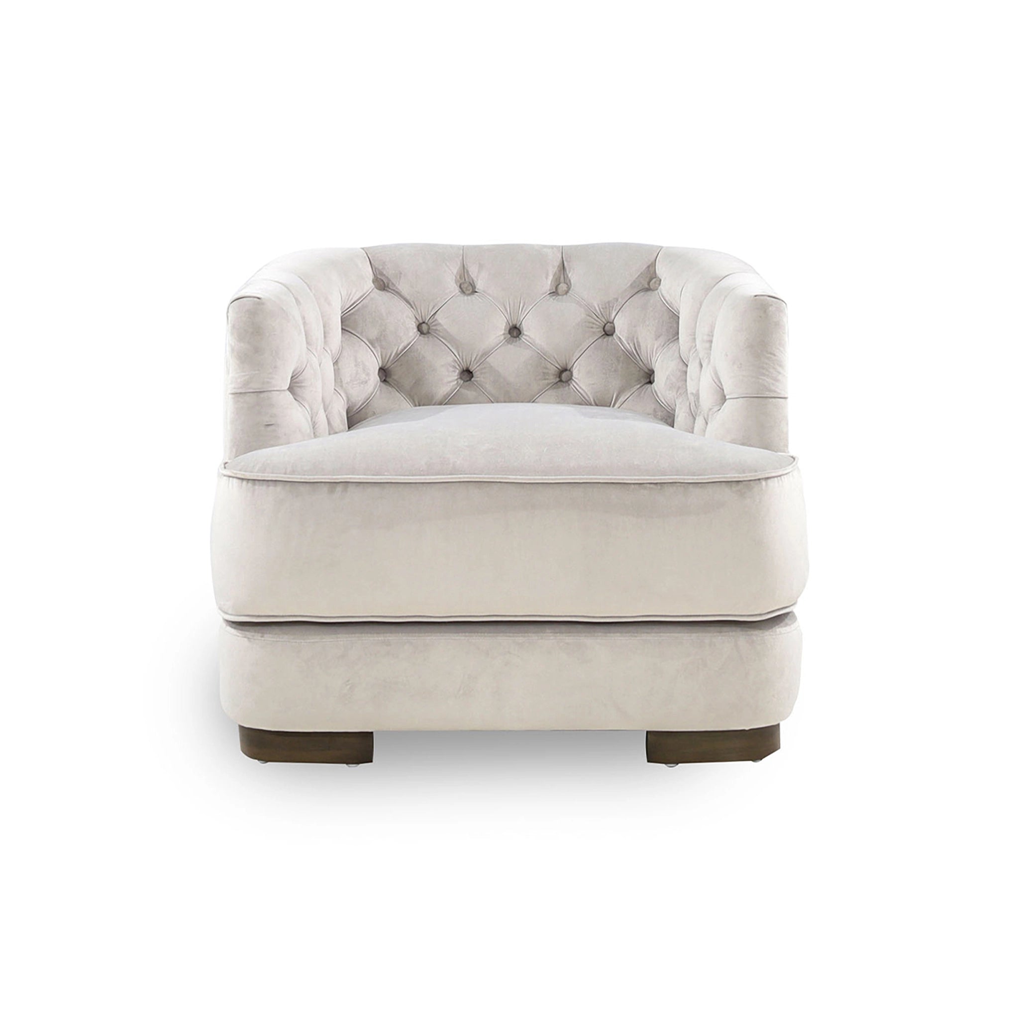 Beige armchair with tufted backrest on a white background