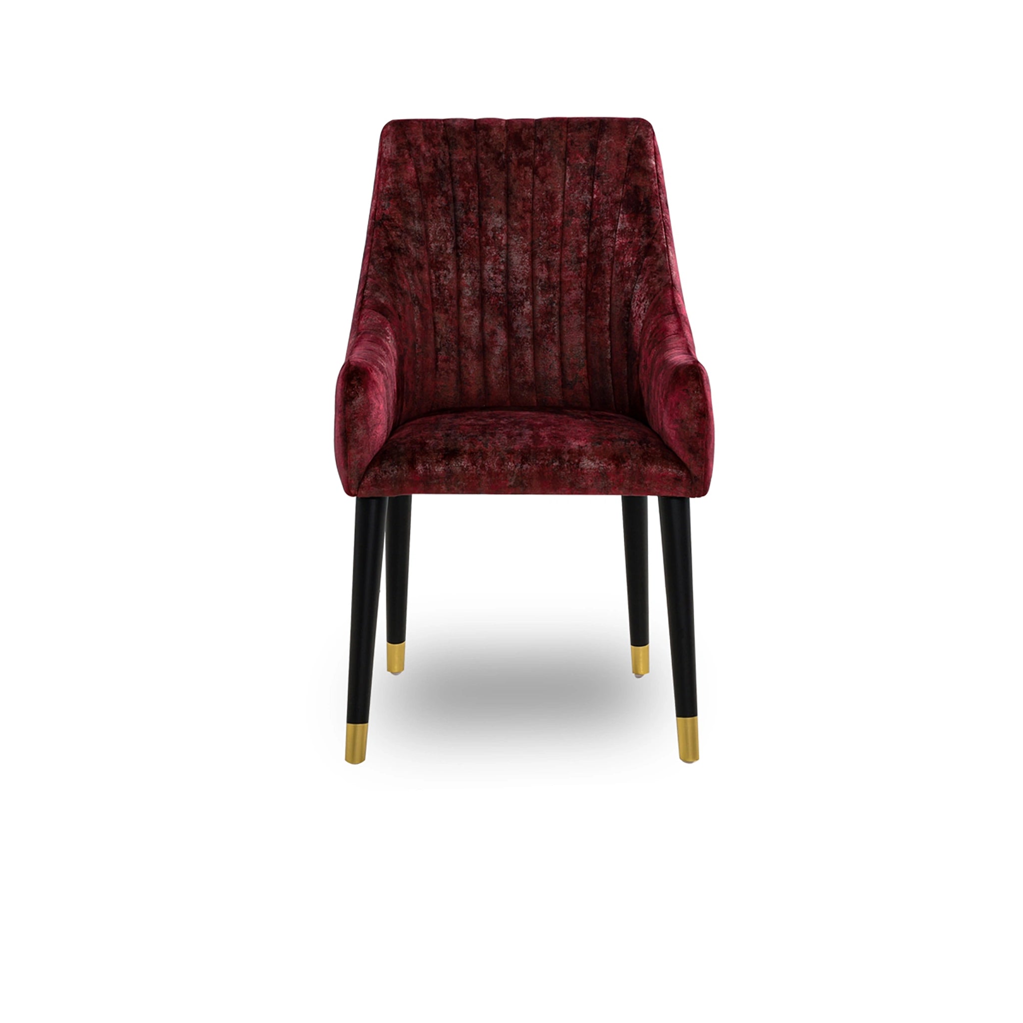 Red velvet chair with black legs and gold feet on a white background