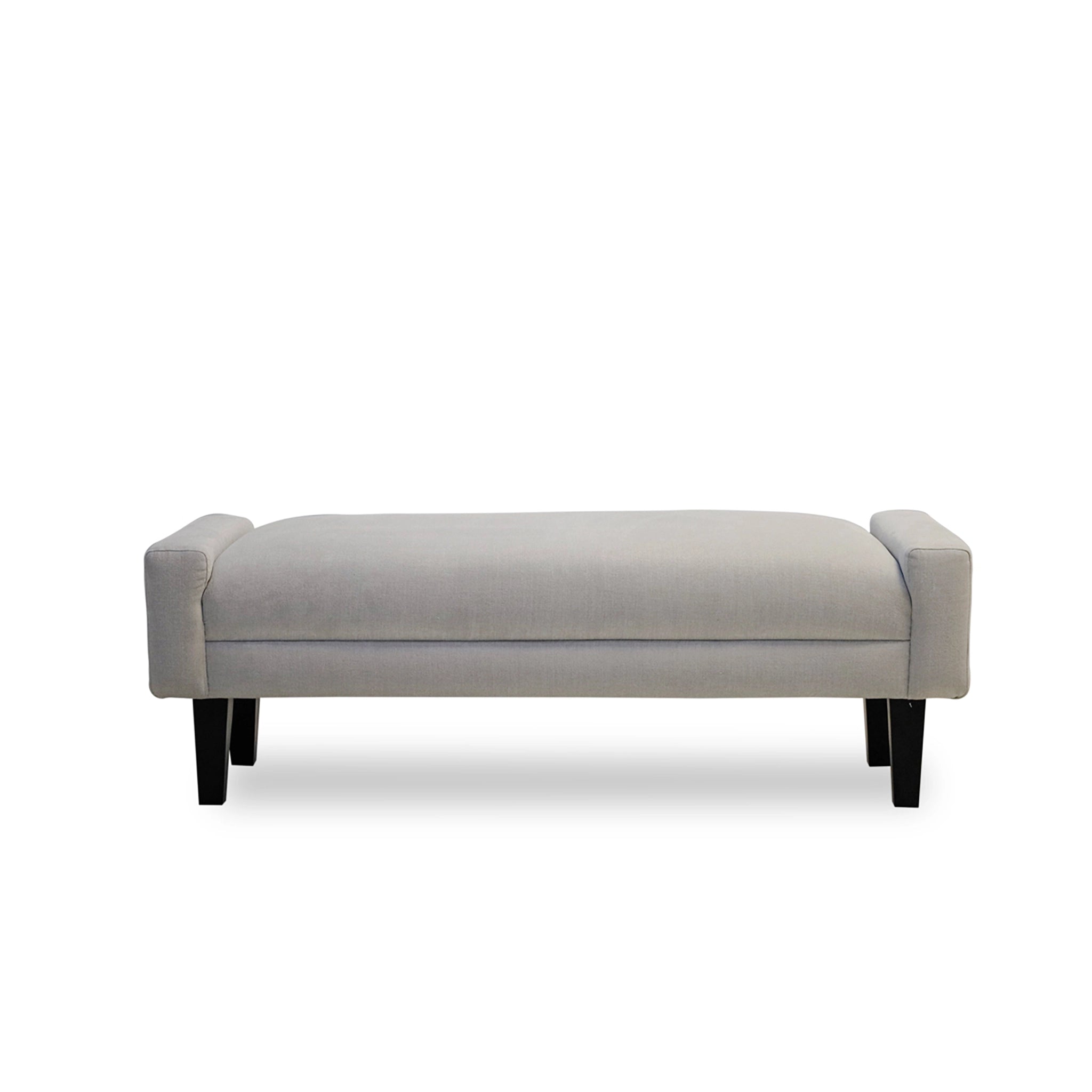 Gray upholstered bench with black legs on a white background