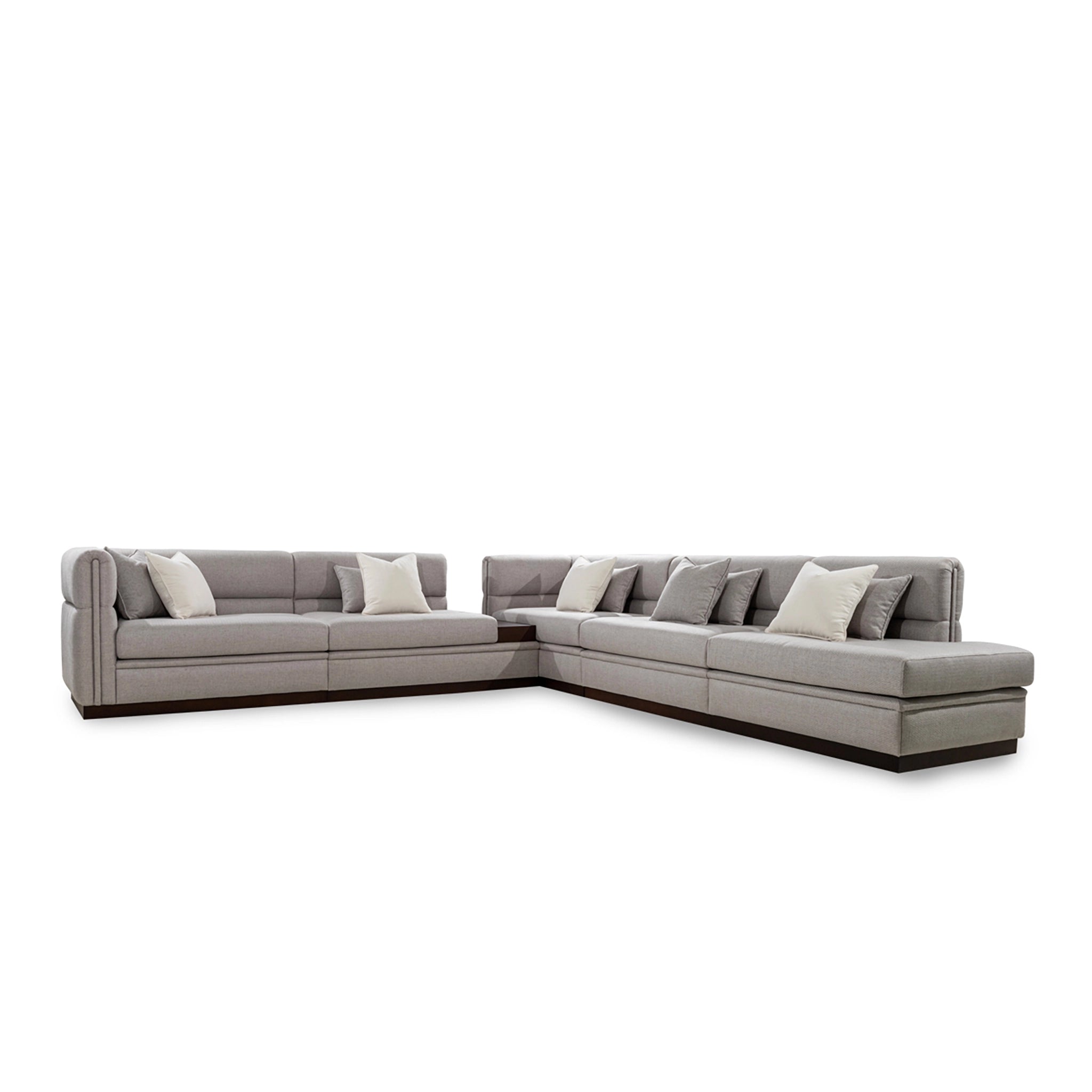 Gray sectional sofa with cushions on a white background