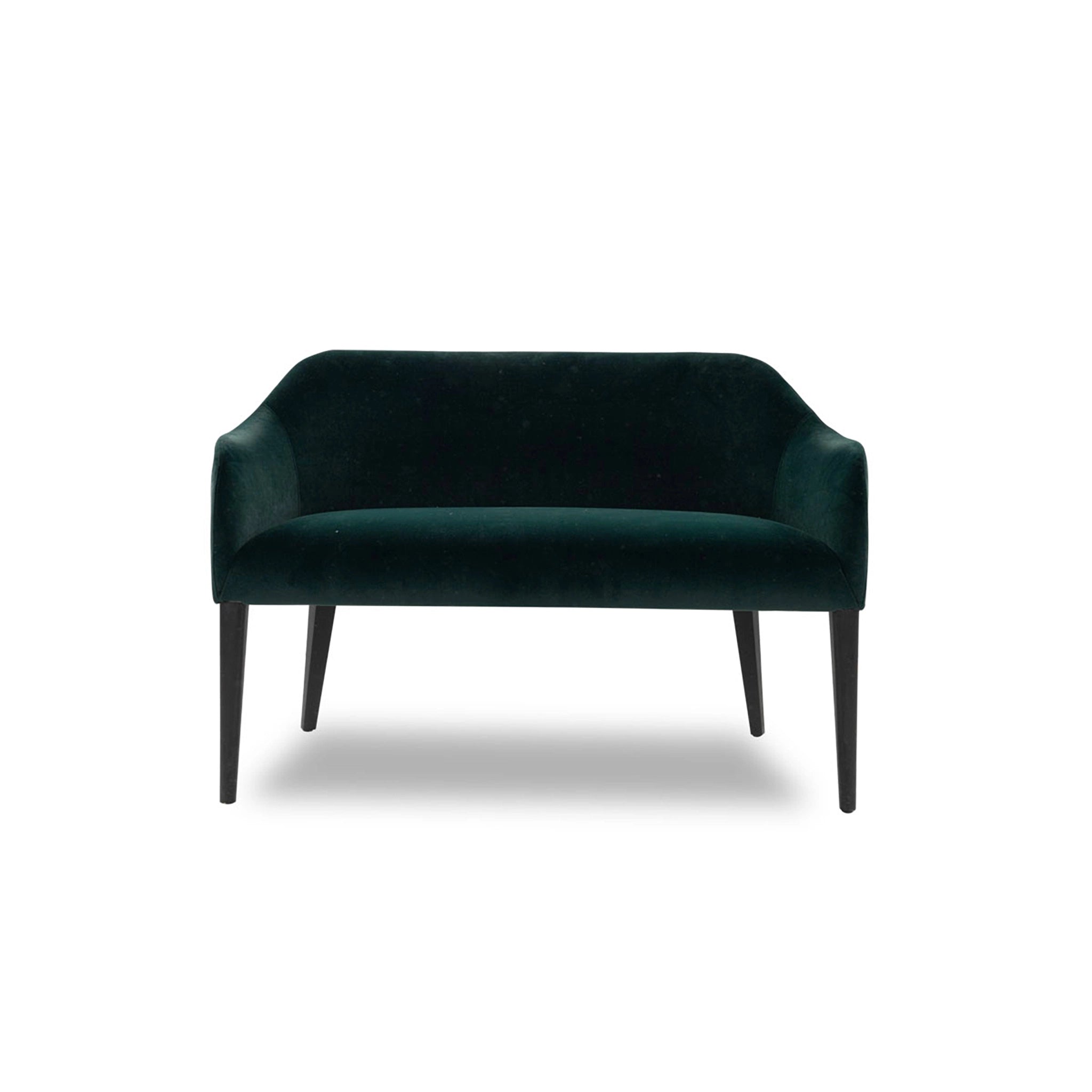 Green velvet sofa on a white background