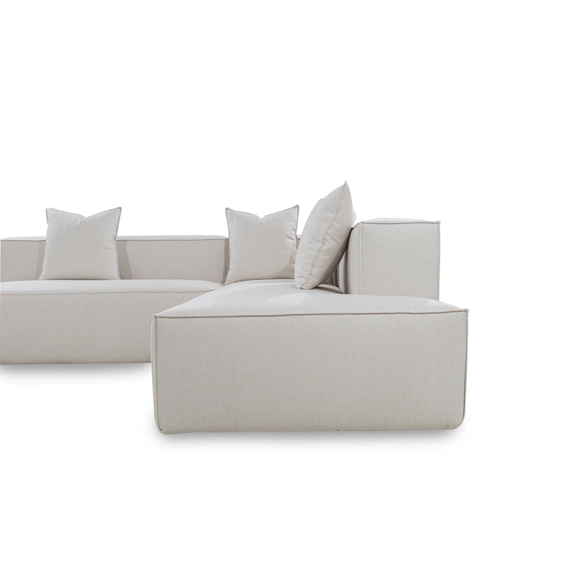 Light gray sectional sofa with cushions on a white background