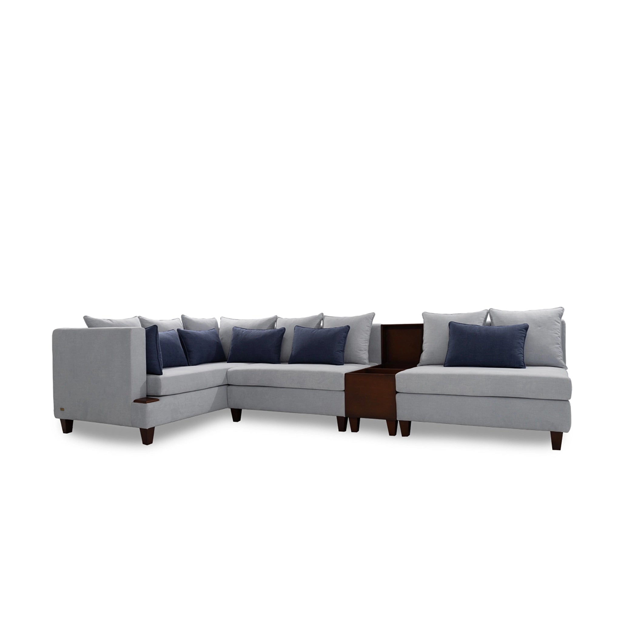 Gray sectional sofa with blue pillows on a white background