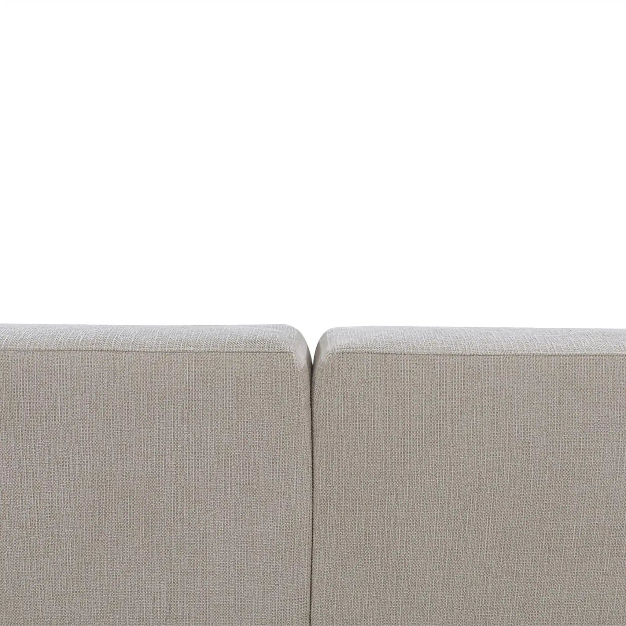 Close-up of a light gray sofa corner on a white background