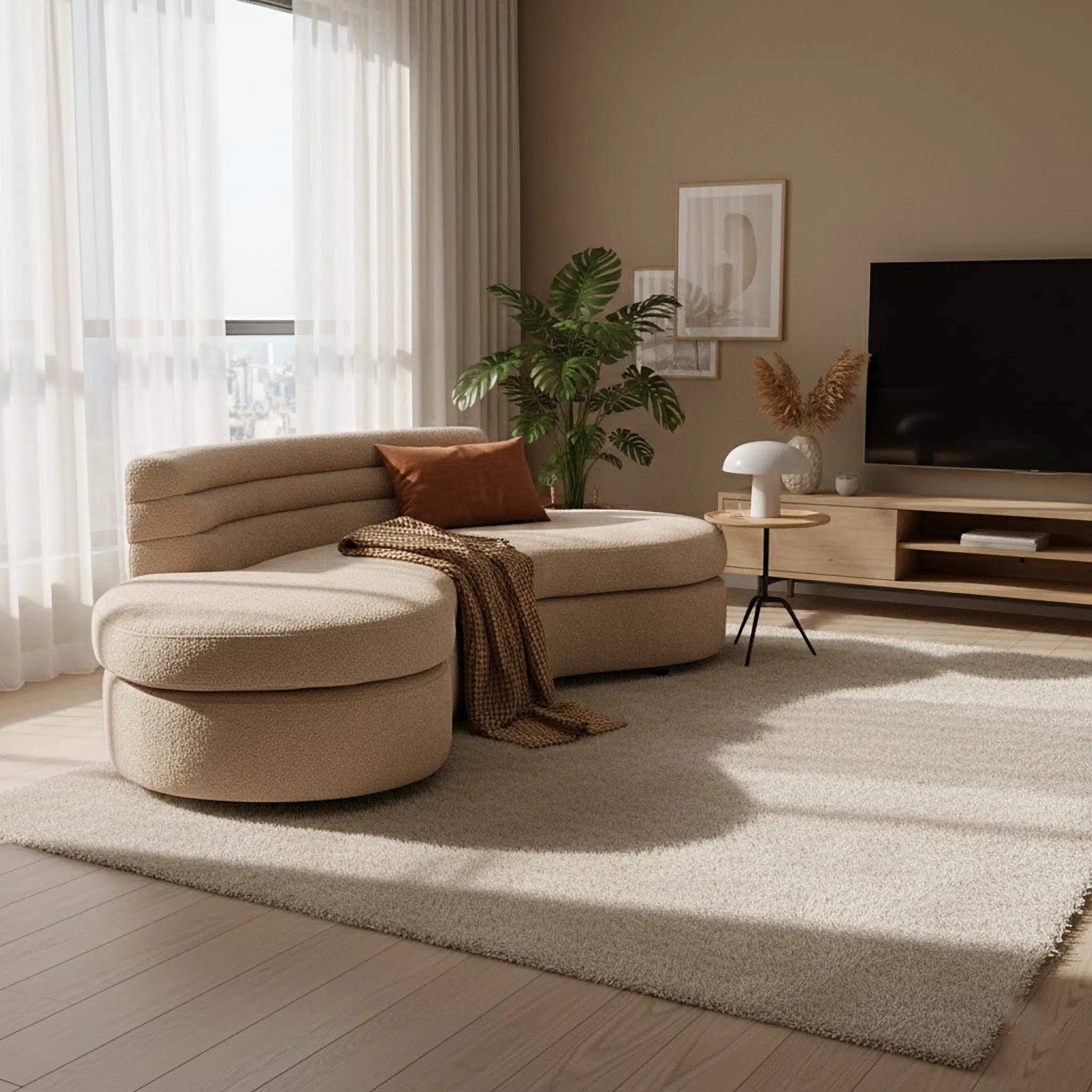 Modern living room with a beige sectional sofa, TV, and decor elements.