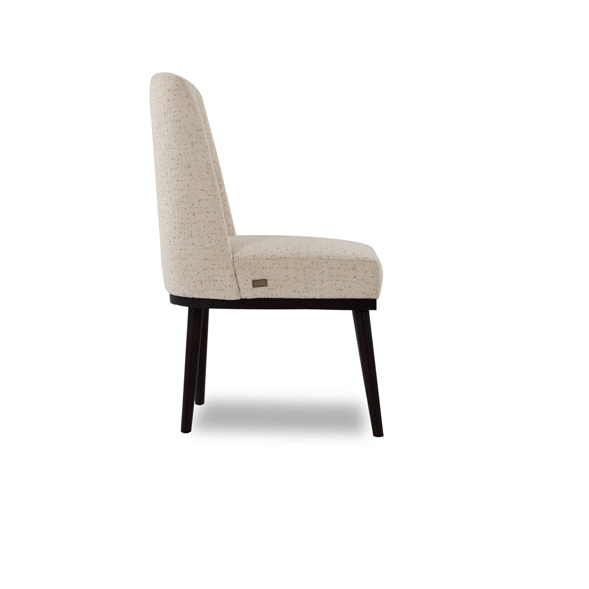 Beige upholstered chair with black legs on a white background
