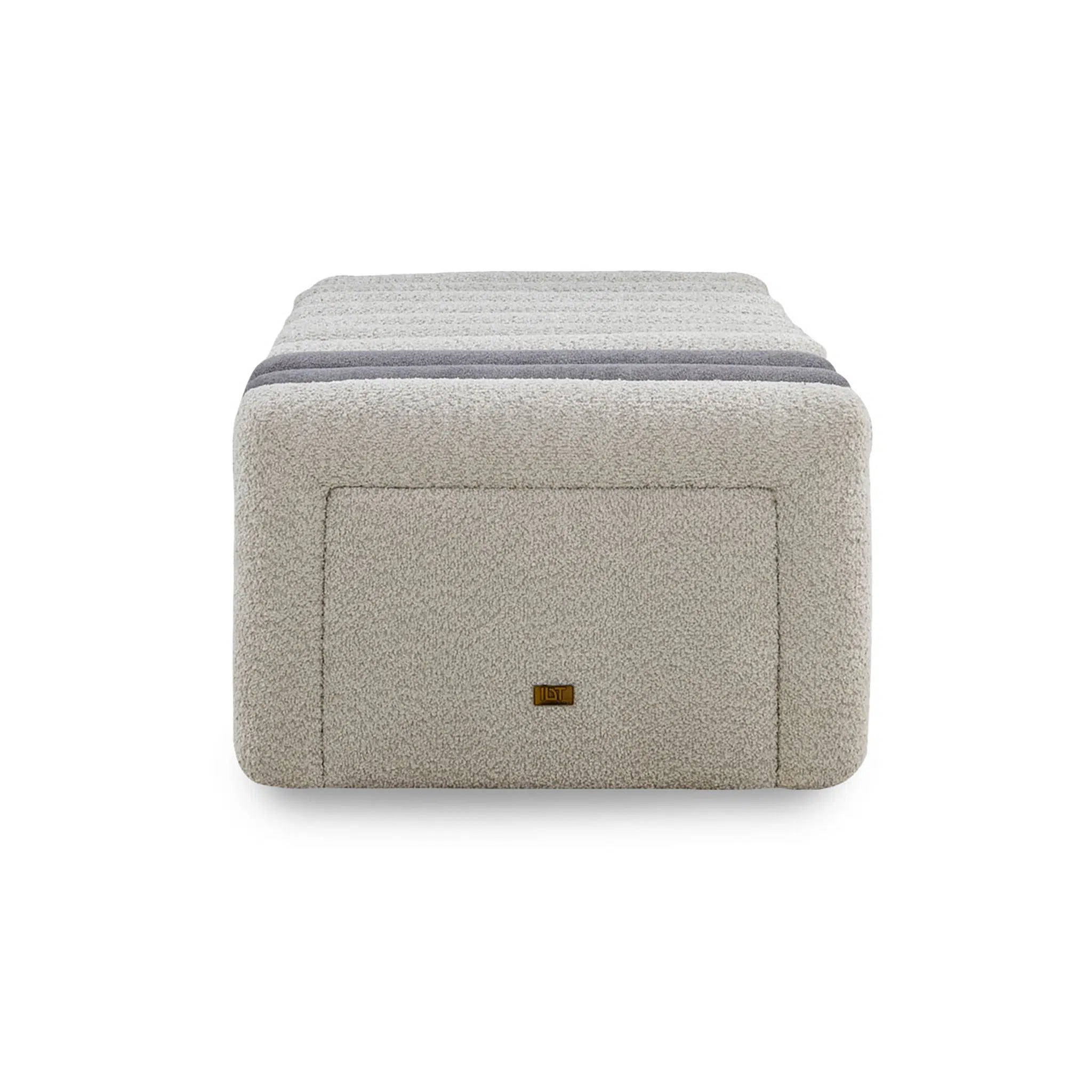 Gray cube-shaped ottoman with a brand logo on a white background