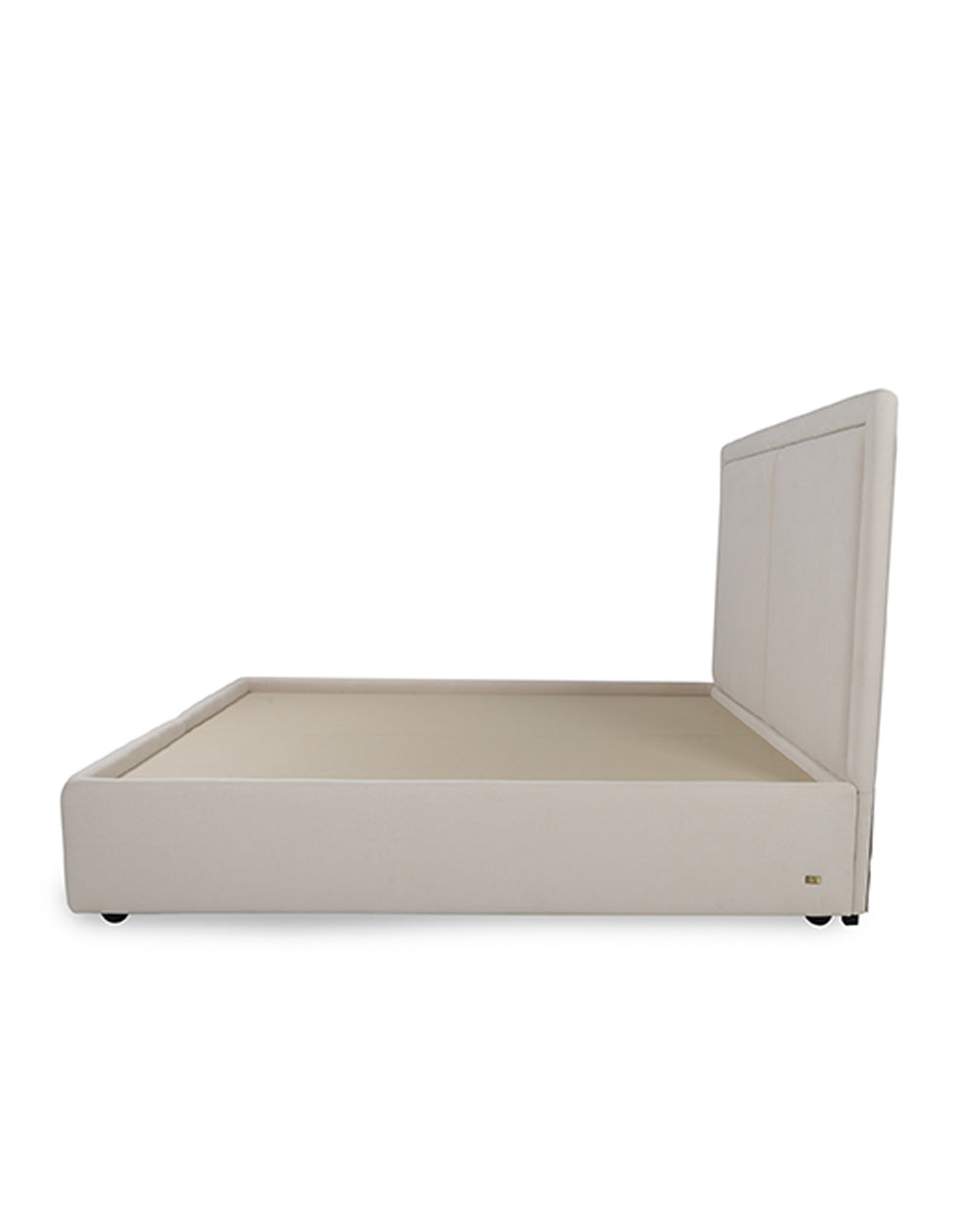 Beige upholstered bed frame on a white background