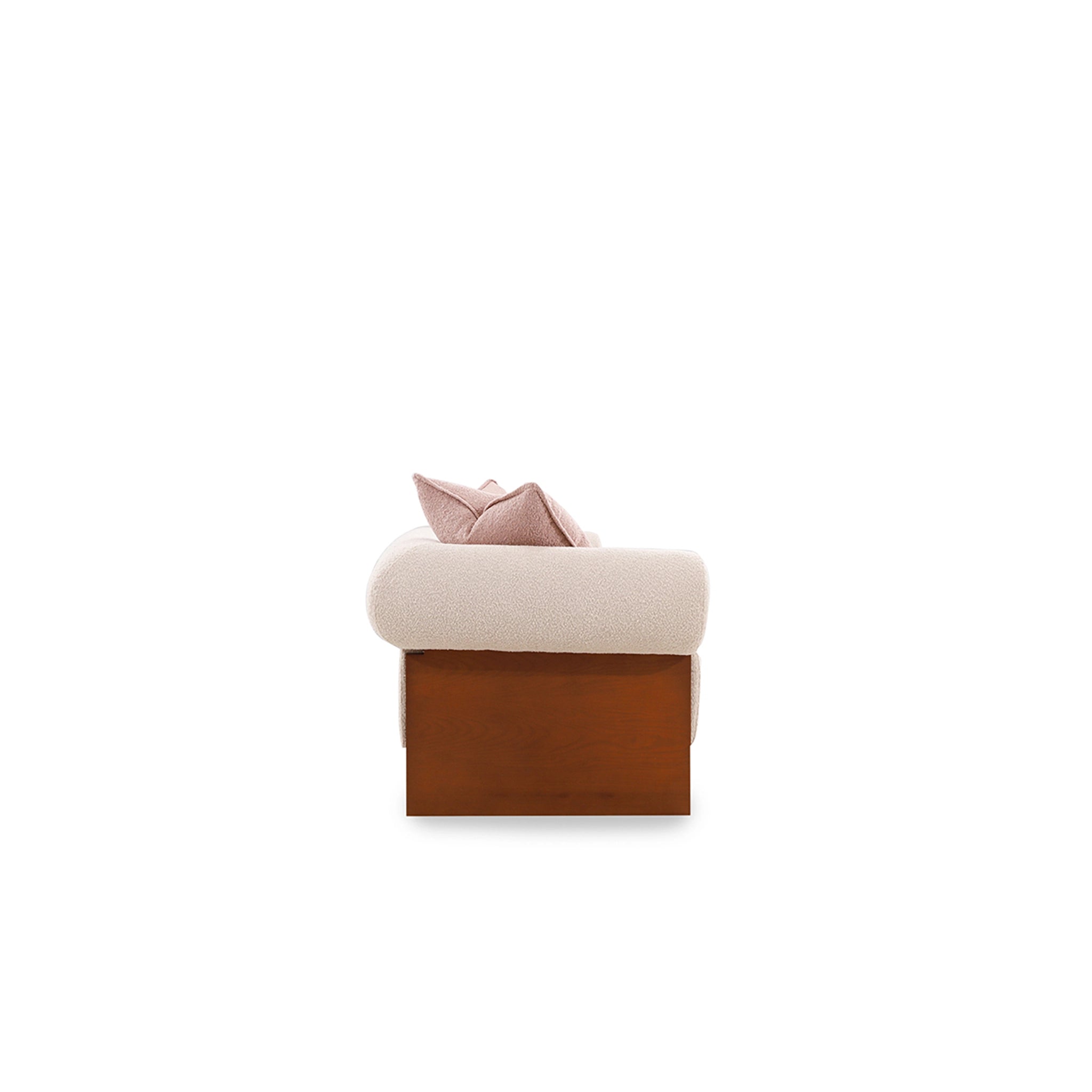 Small ottoman with a pink cushion on a white background