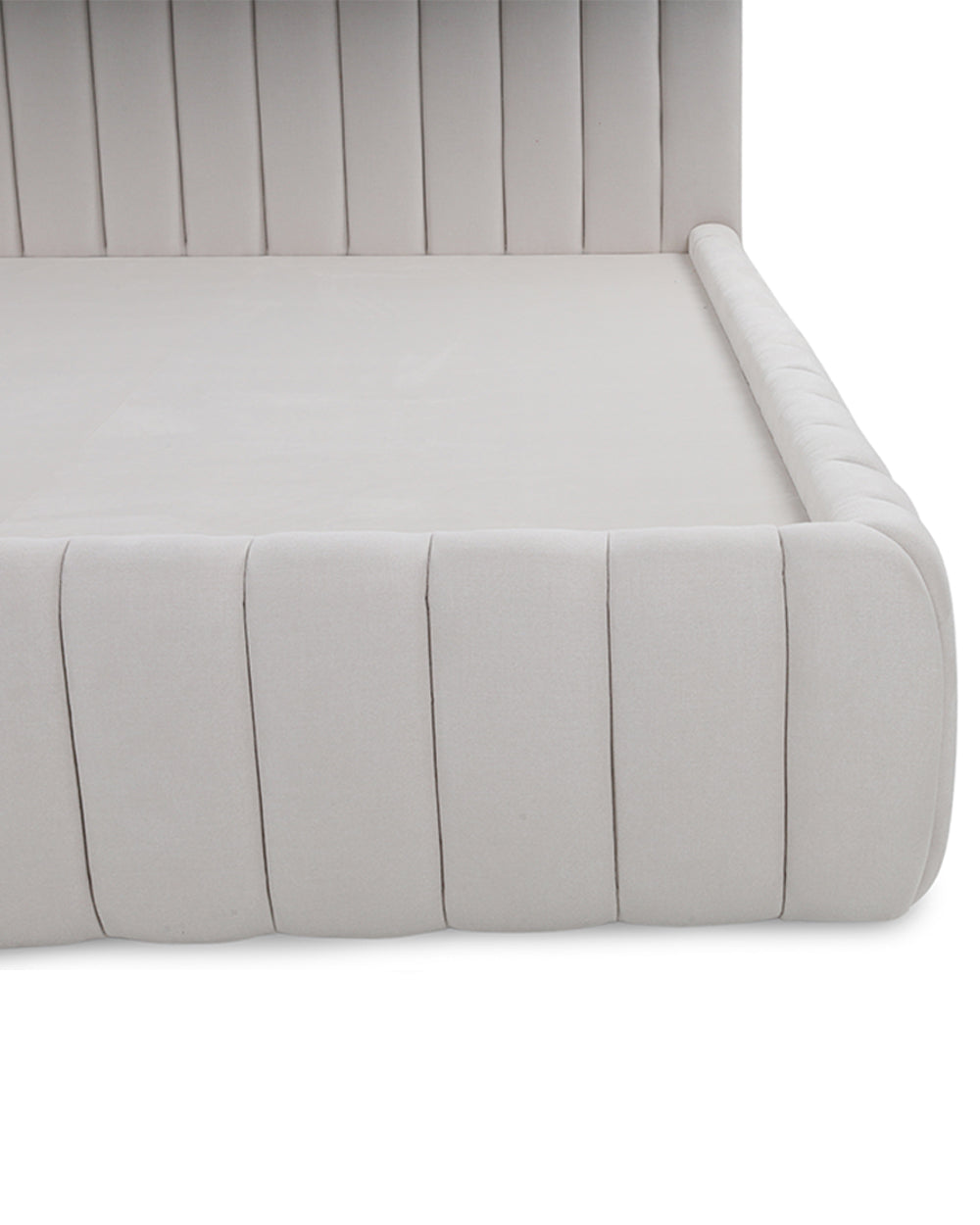 Gray upholstered bed with a tufted design on a white background