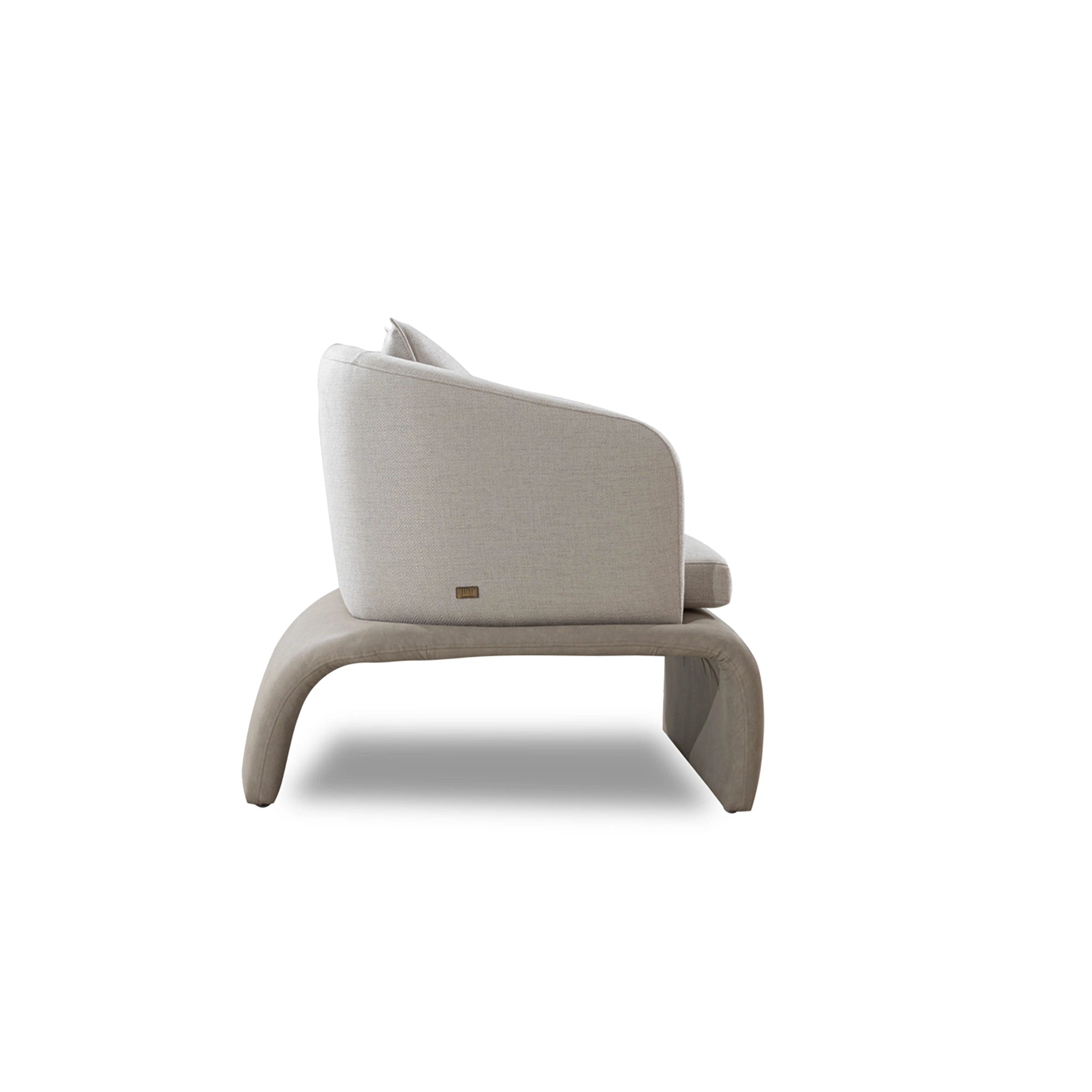 Modern beige armchair on a white background