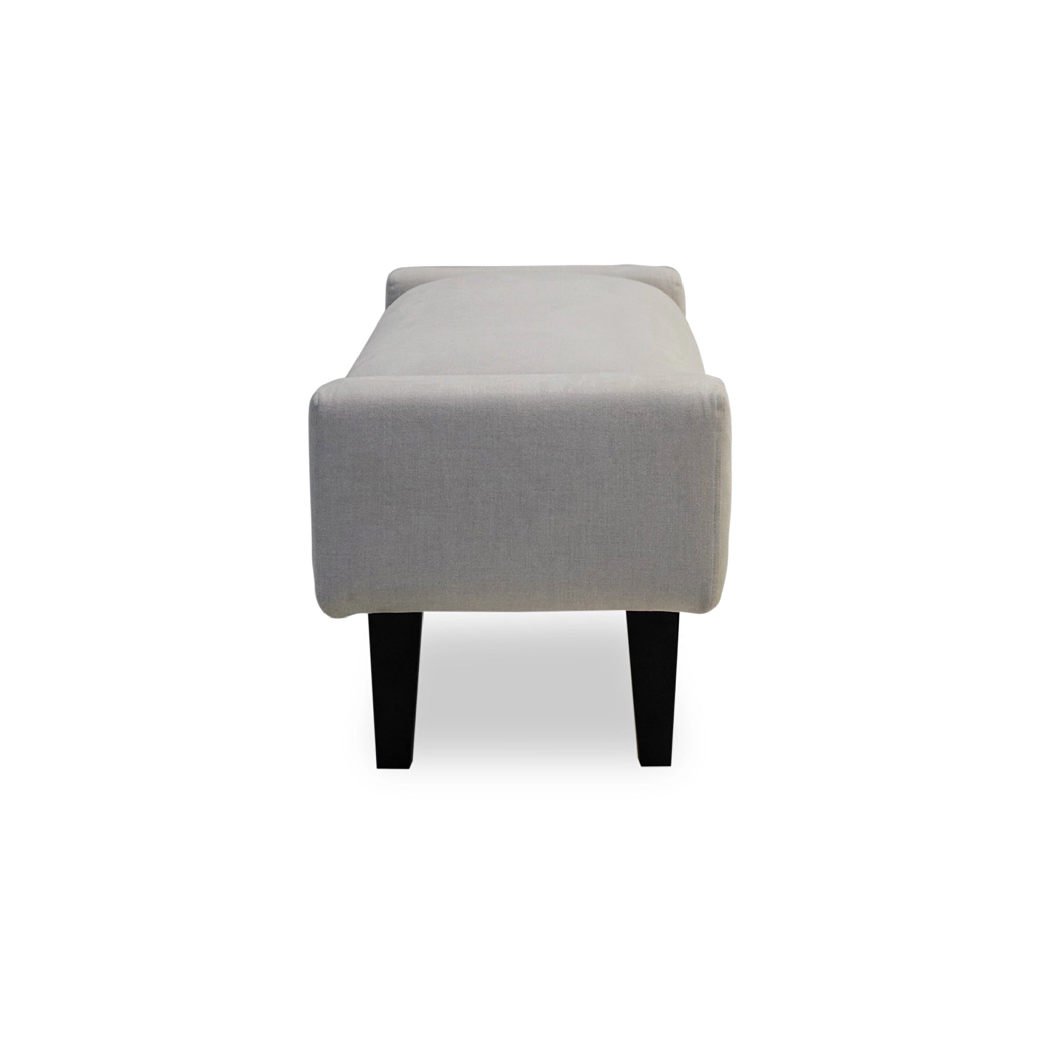 Gray upholstered bench with black legs on a white background