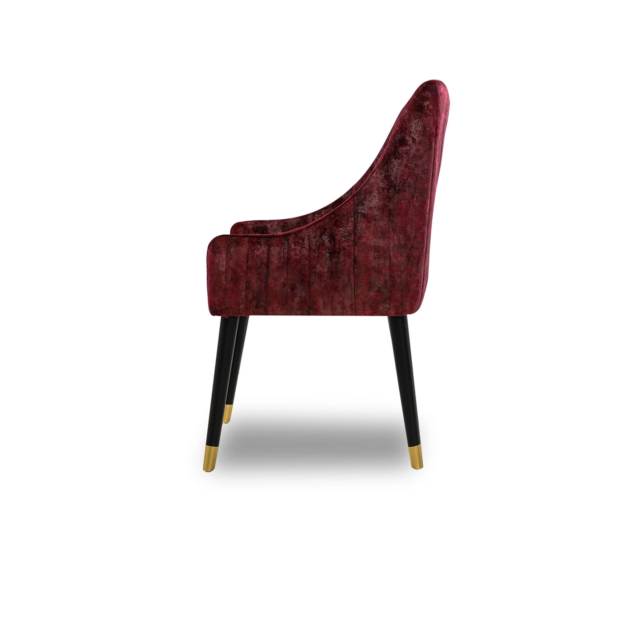 Red velvet chair with black legs on a white background