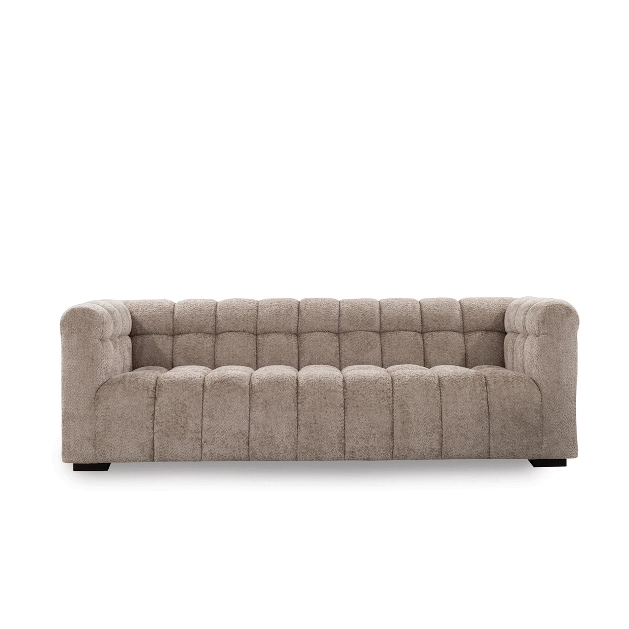 Beige tufted sofa on a white background
