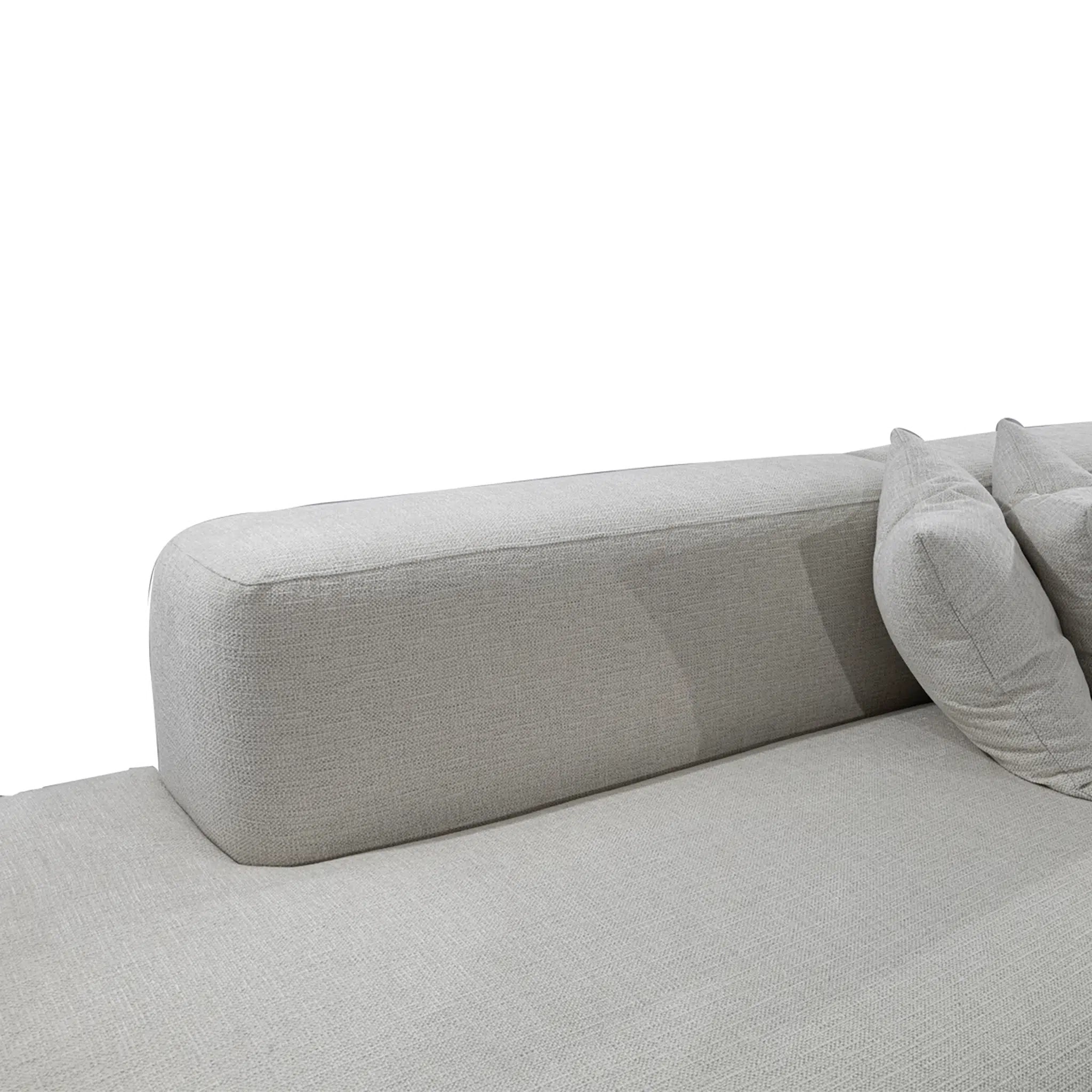 Gray sofa with a pillow on a white background