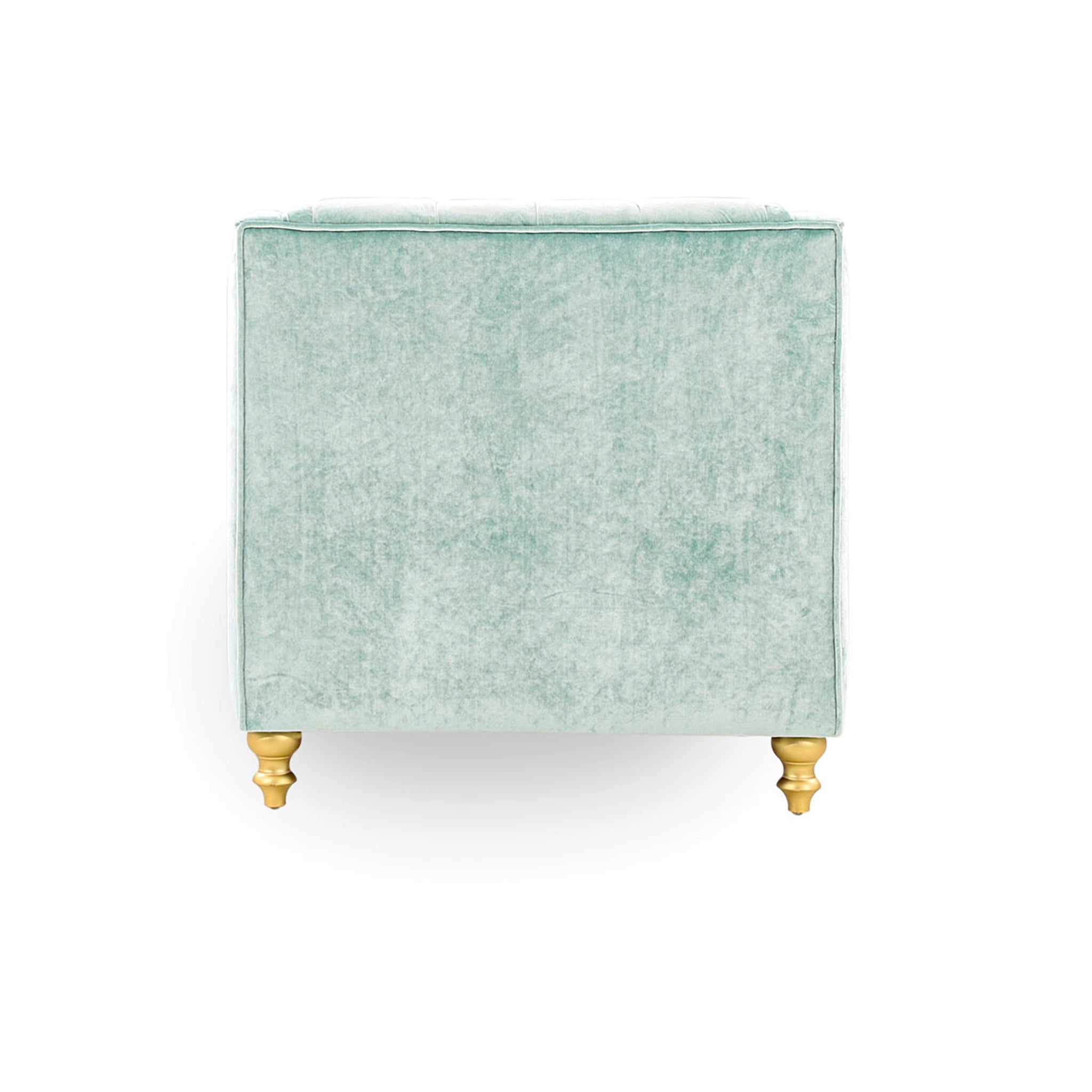 Green velvet side table with gold legs on a white background