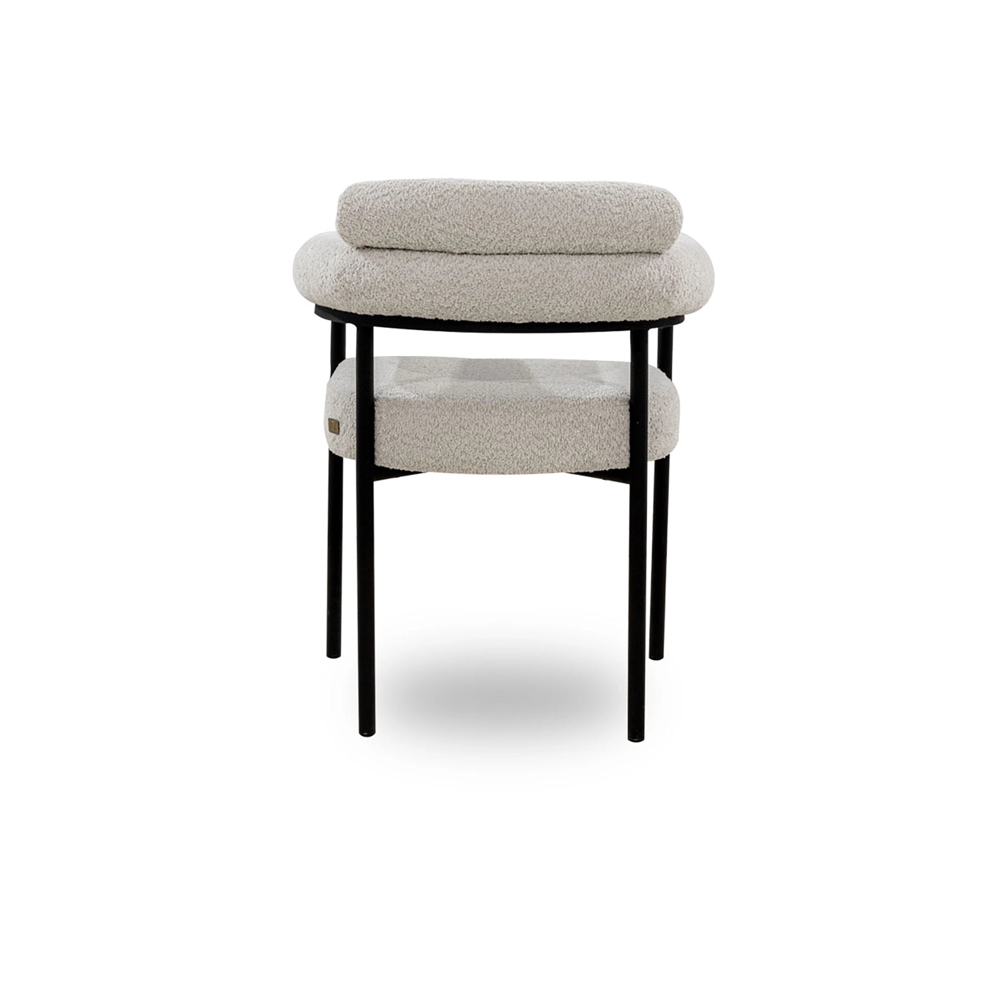 Stool with a textured top and black legs on a white background
