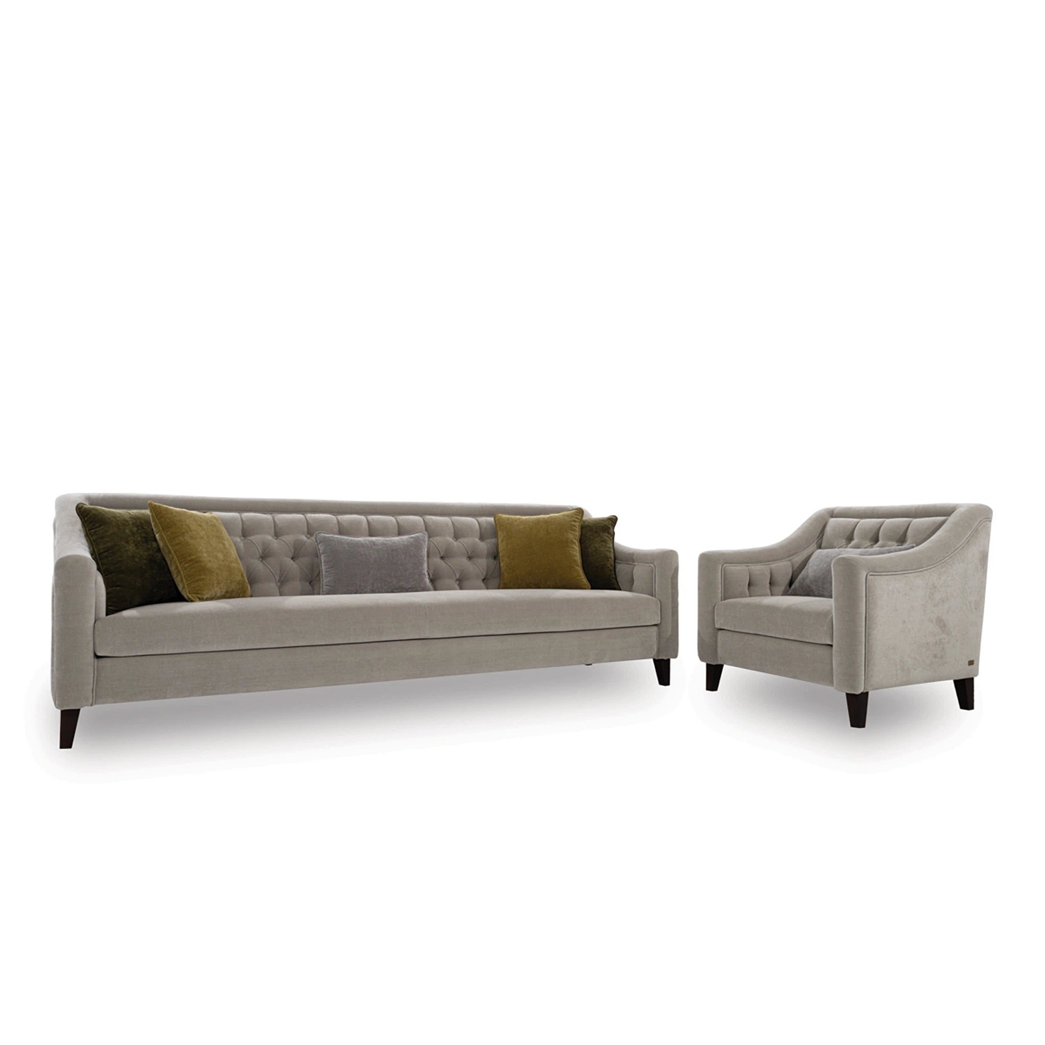 Gray sofa with green and brown cushions and a matching armchair on a white background