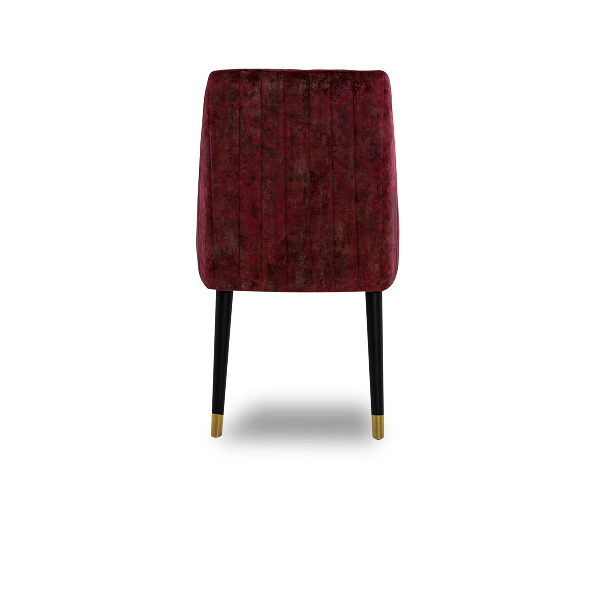 Red velvet chair with black legs on a white background