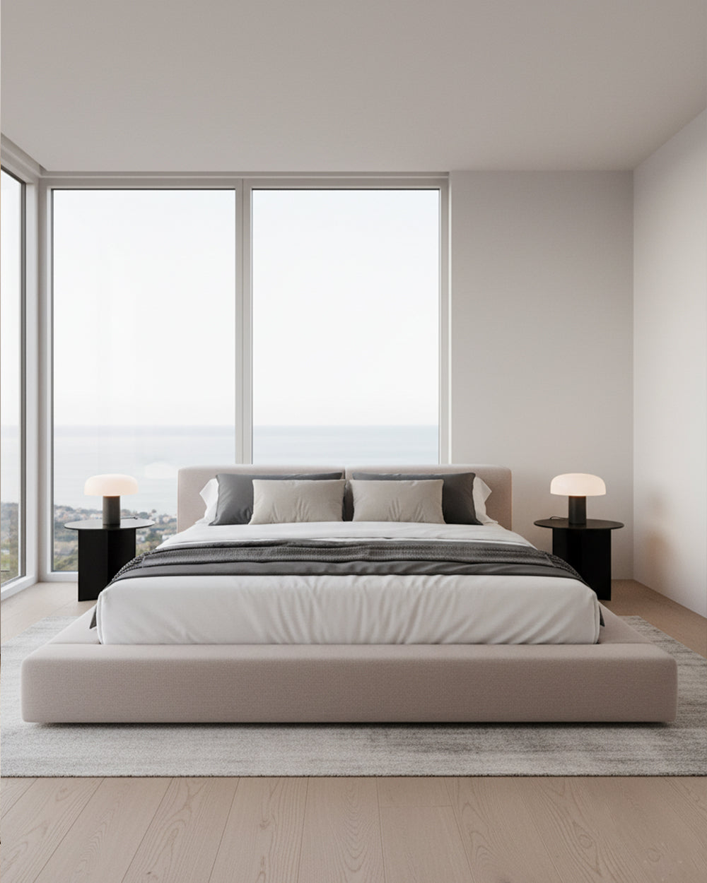 Modern bedroom with a large bed and large windows.