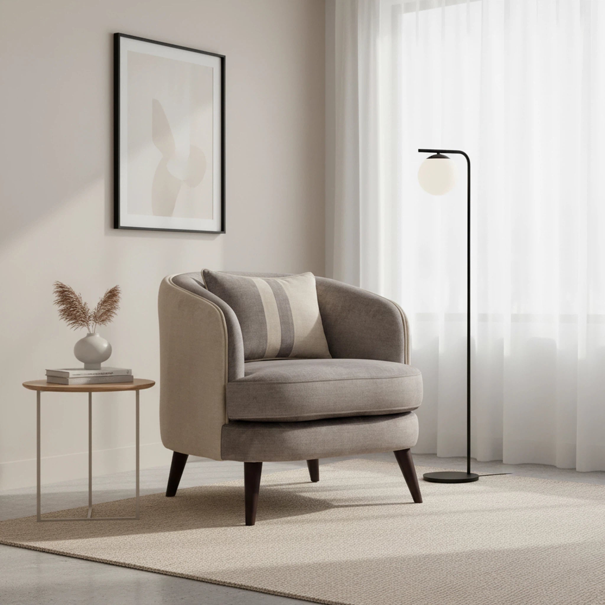 Beige armchair in a modern living room with a side table and floor lamp.