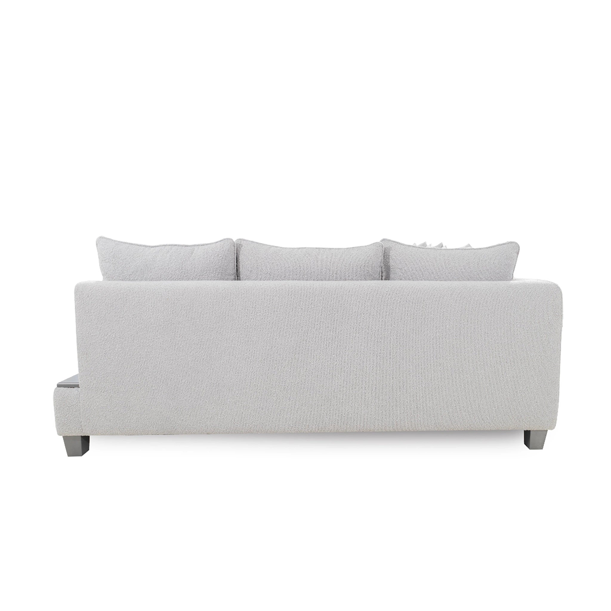 Gray sofa with three cushions on a white background