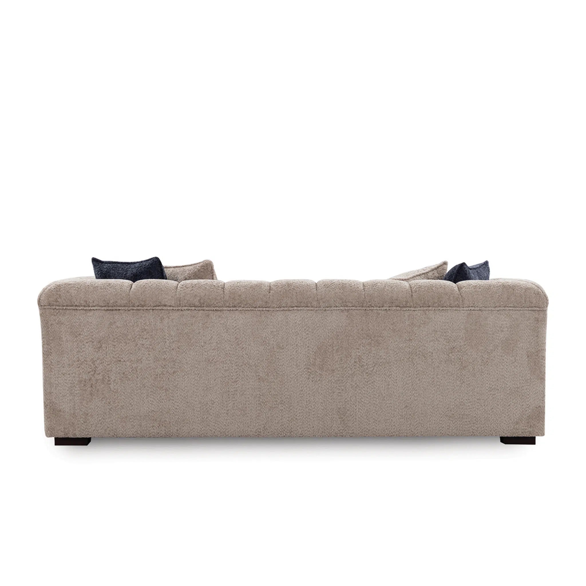 Beige sofa with dark cushions on a white background