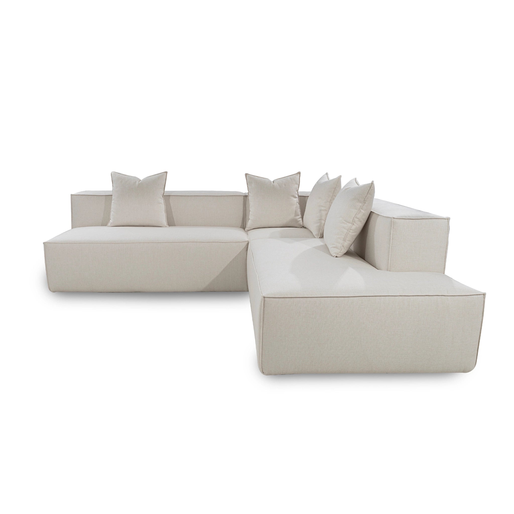 Beige sectional sofa with cushions on a white background