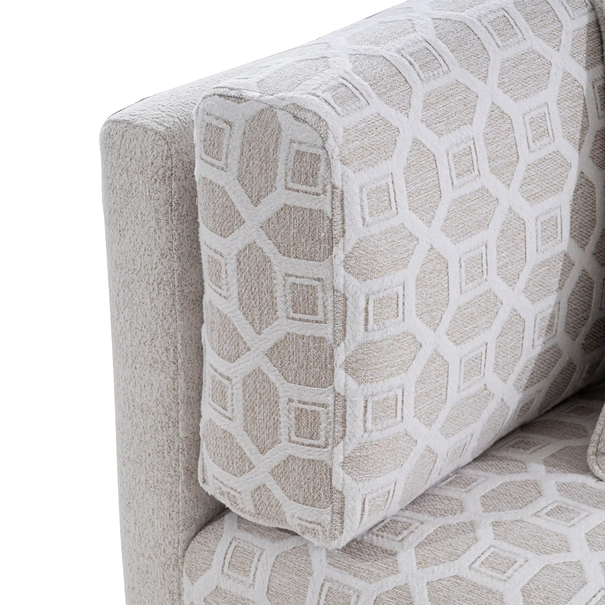 Close-up of a patterned sofa with geometric design on a white background