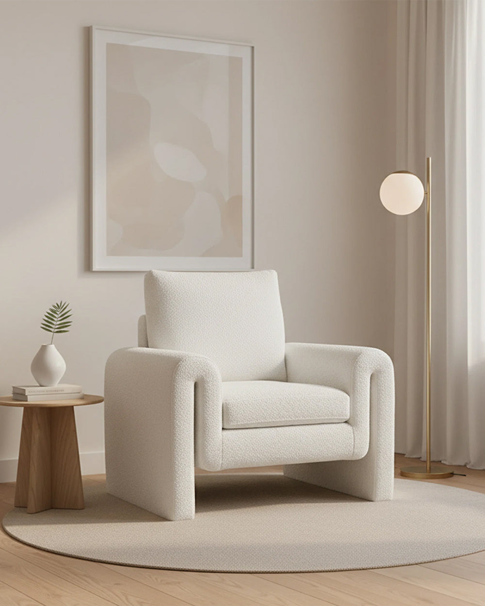 White armchair in a modern living room with a neutral color palette.