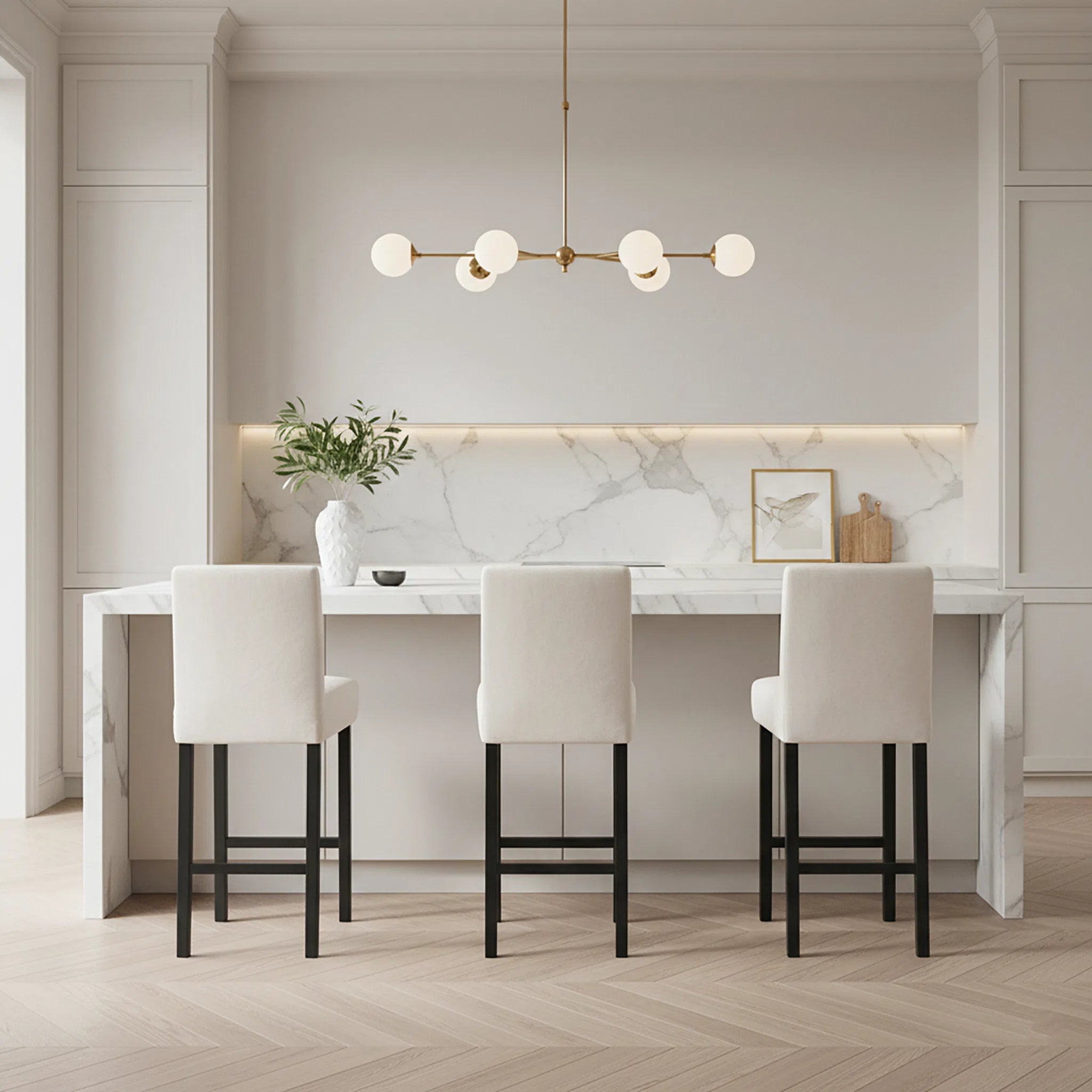 Modern kitchen with marble countertop, white chairs, and decorative elements.