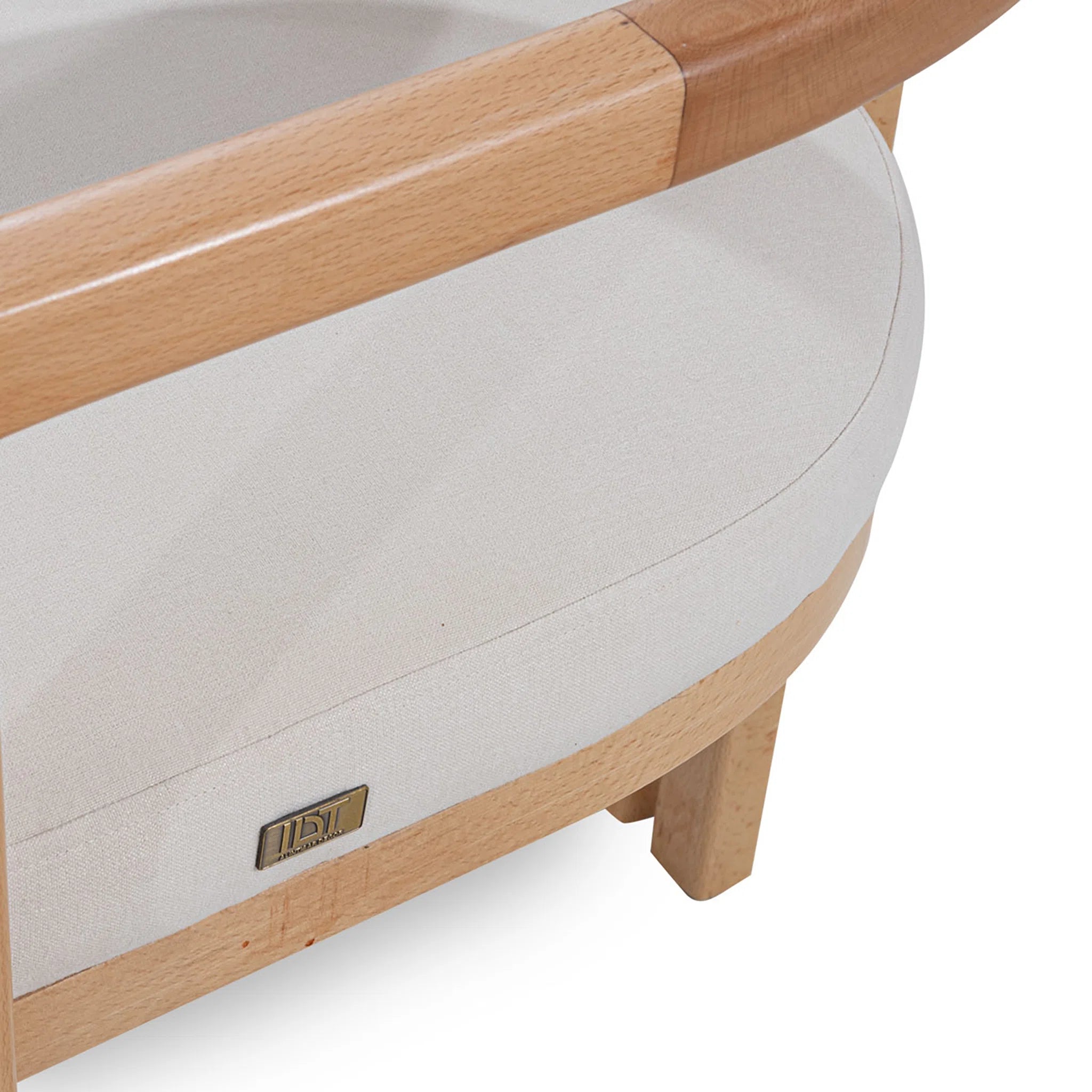 Wooden crib with beige mattress on a white background
