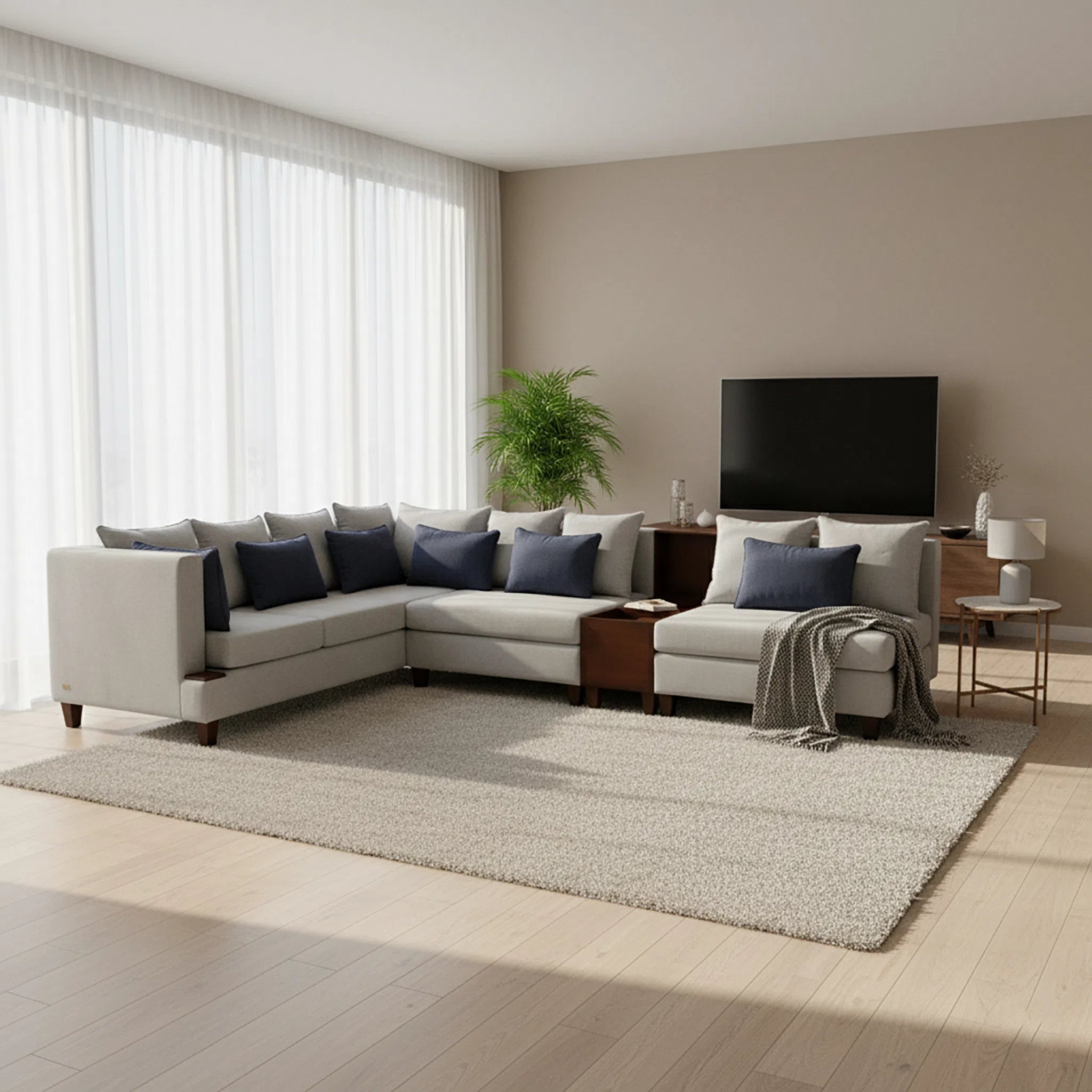 Modern living room with a sectional sofa, TV, and decorative items.