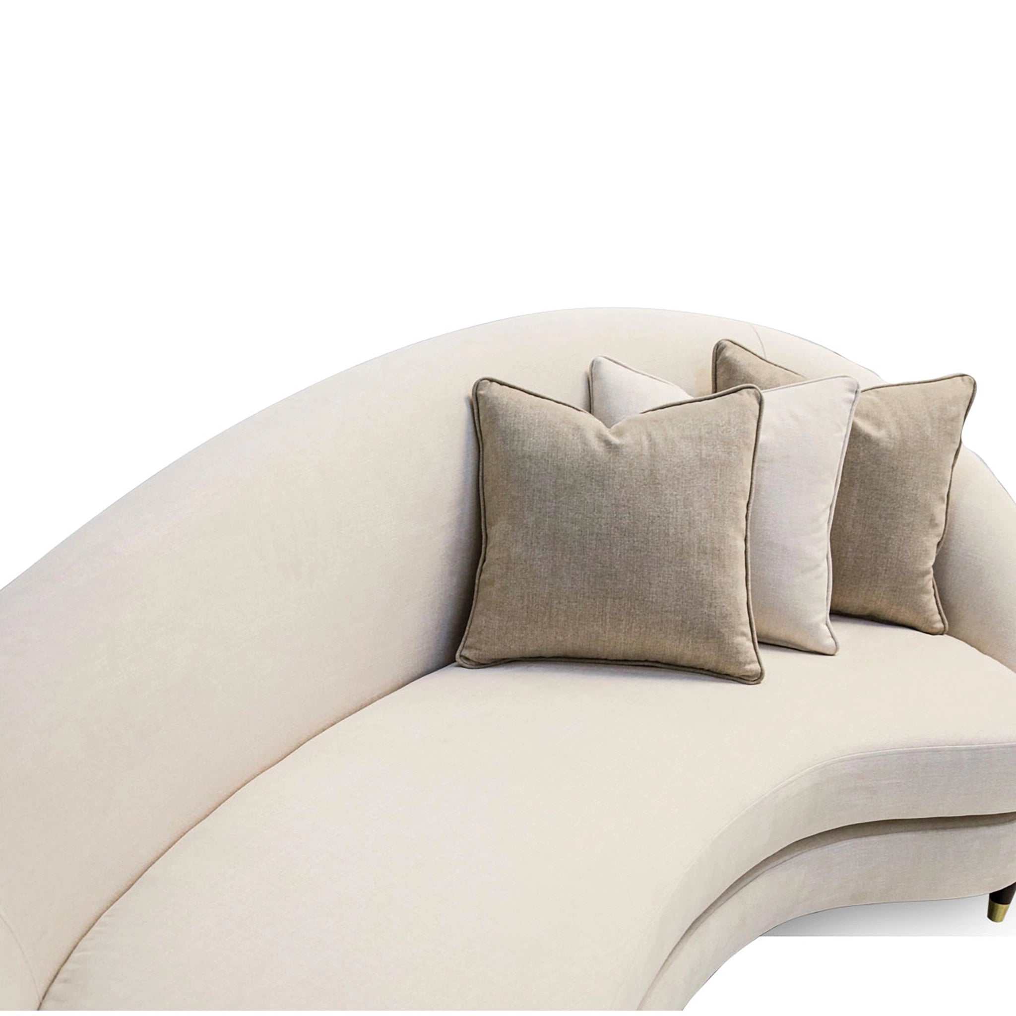Beige curved sofa with decorative pillows on a white background