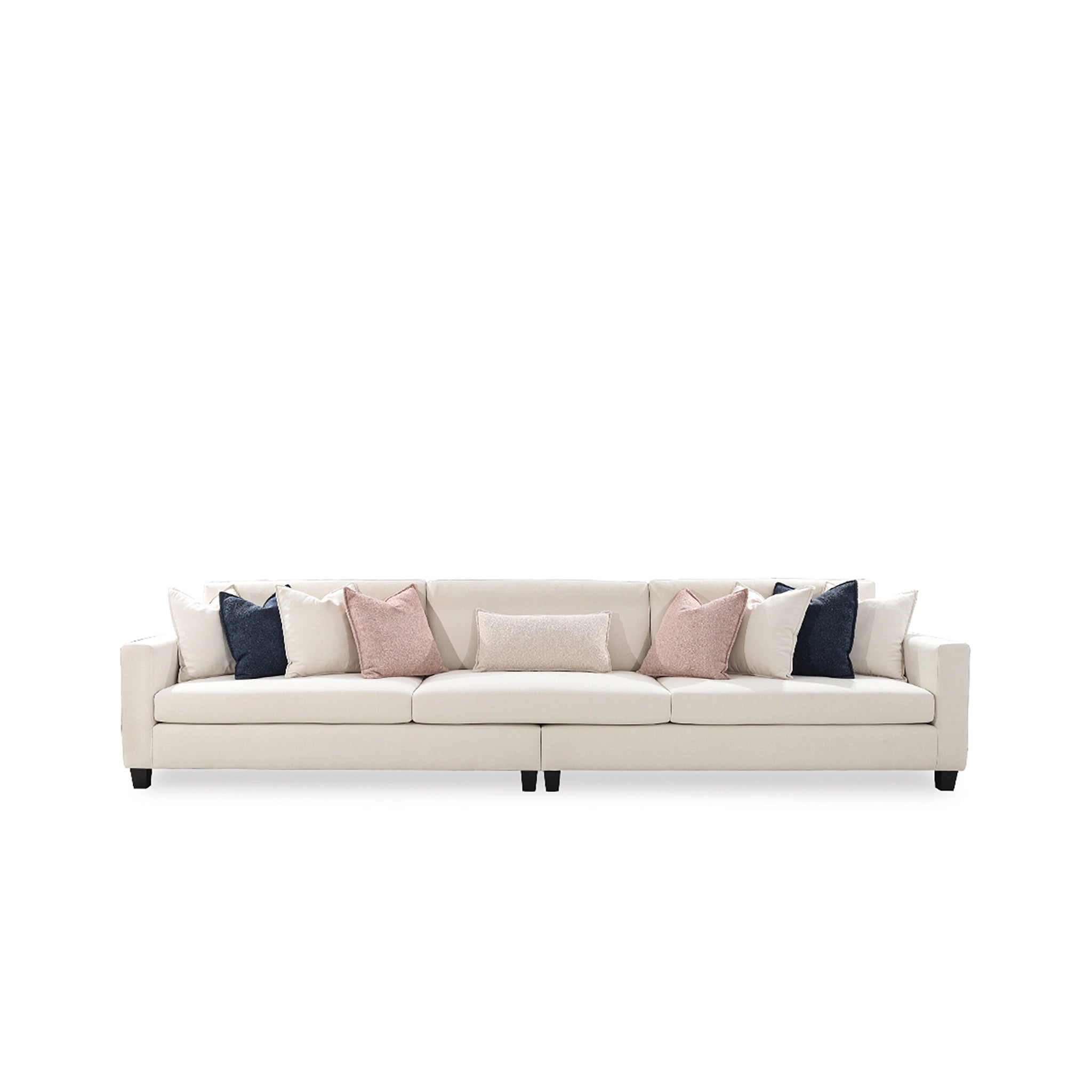 Beige sofa with colorful cushions on a white background